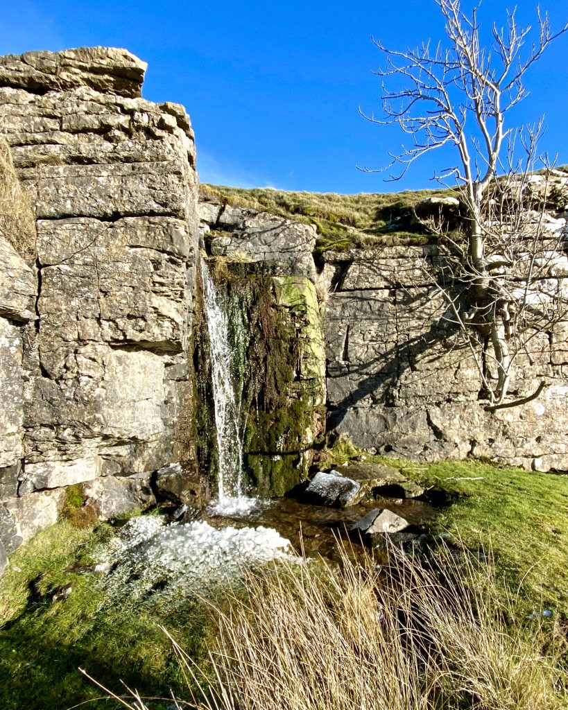 Waterfall created by Barney Beck, between Low Scar and Redmire Scar on the southern side of Redmire Quarry.