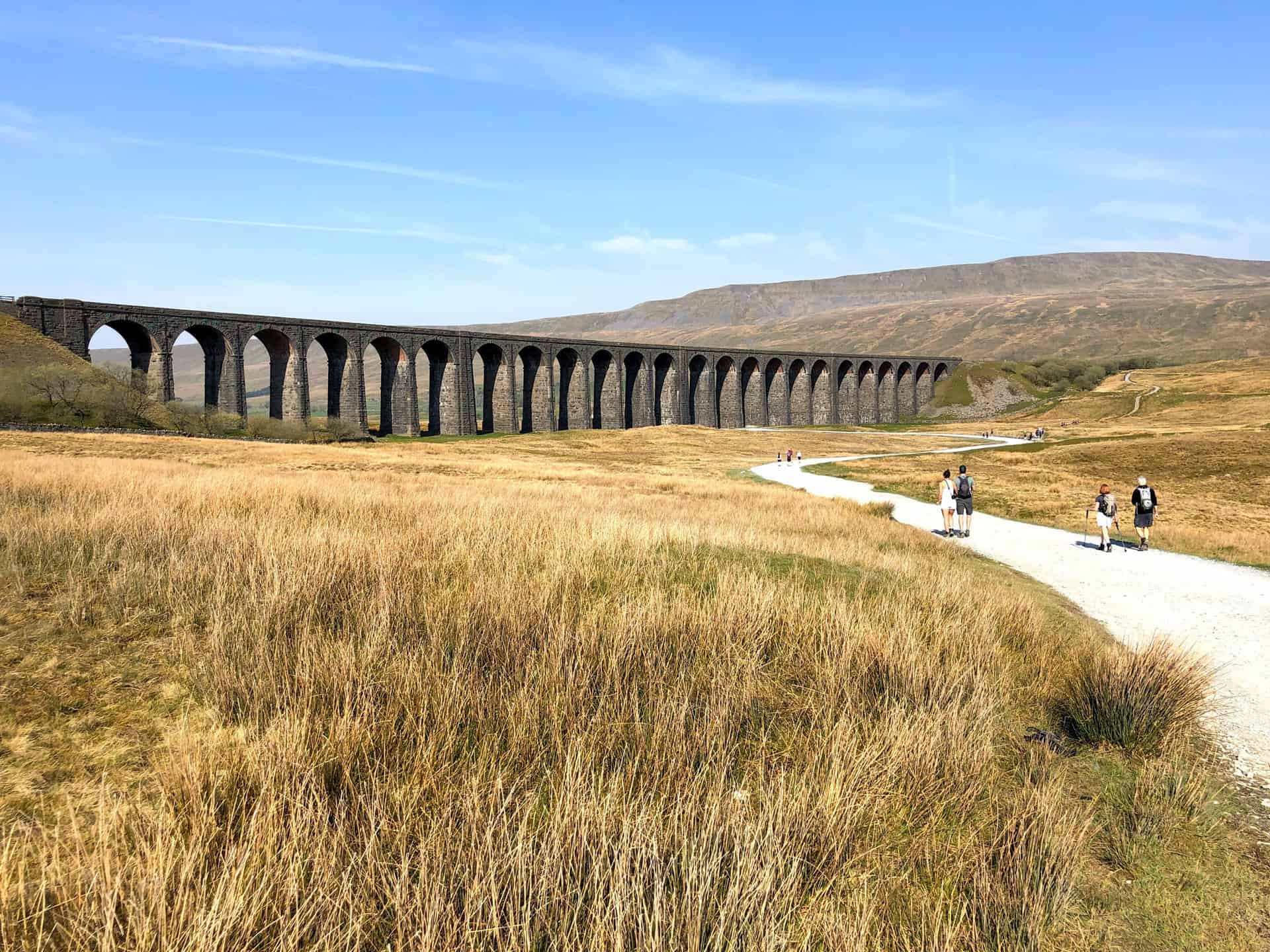 Walkers approaching the Ribblehead Viaduct.