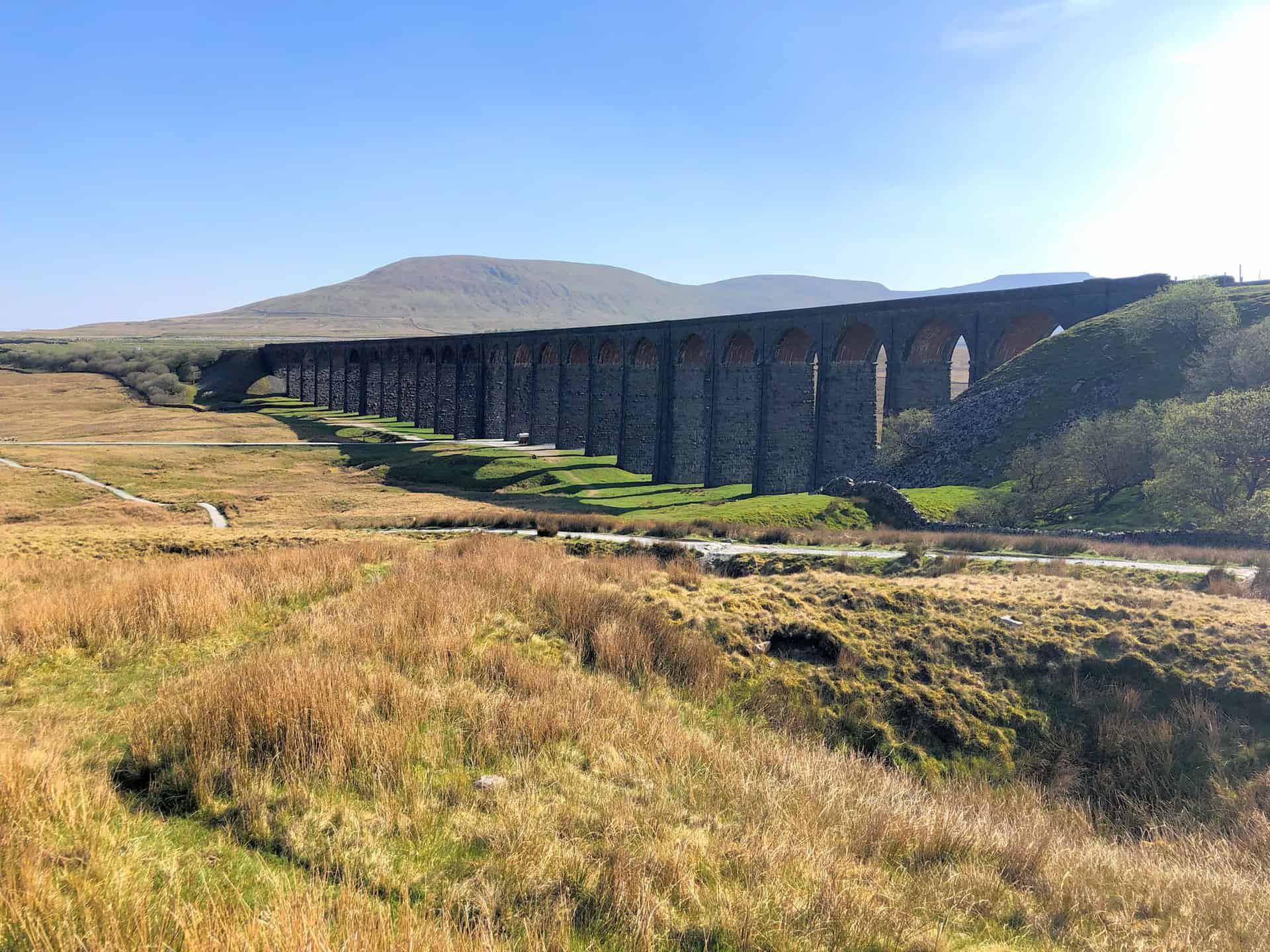 Ribblehead Viaduct with Park Fell and Ingleborough in the background.