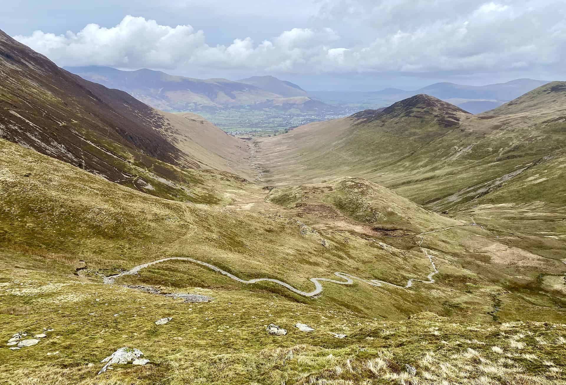 The winding path down to Force Crag Mine, and the shallow U-shaped valley between Grisedale Pike (left) and Outerside (right). Coledale Beck meanders its way along the valley floor to Braithwaite and joins Newlands Beck just west of the village.