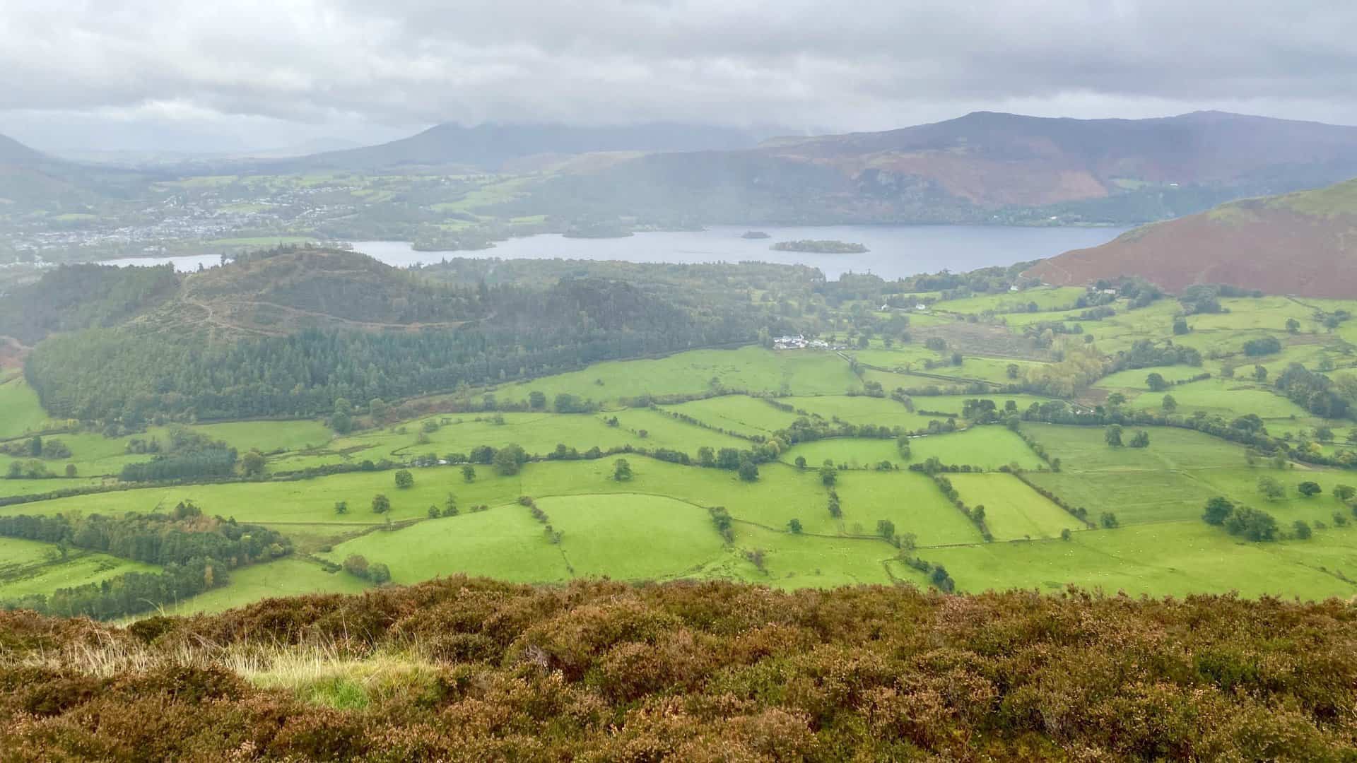 The Newlands valley and Derwent Water. The wooded hill on the left is Swinside, with Keswick in the background.