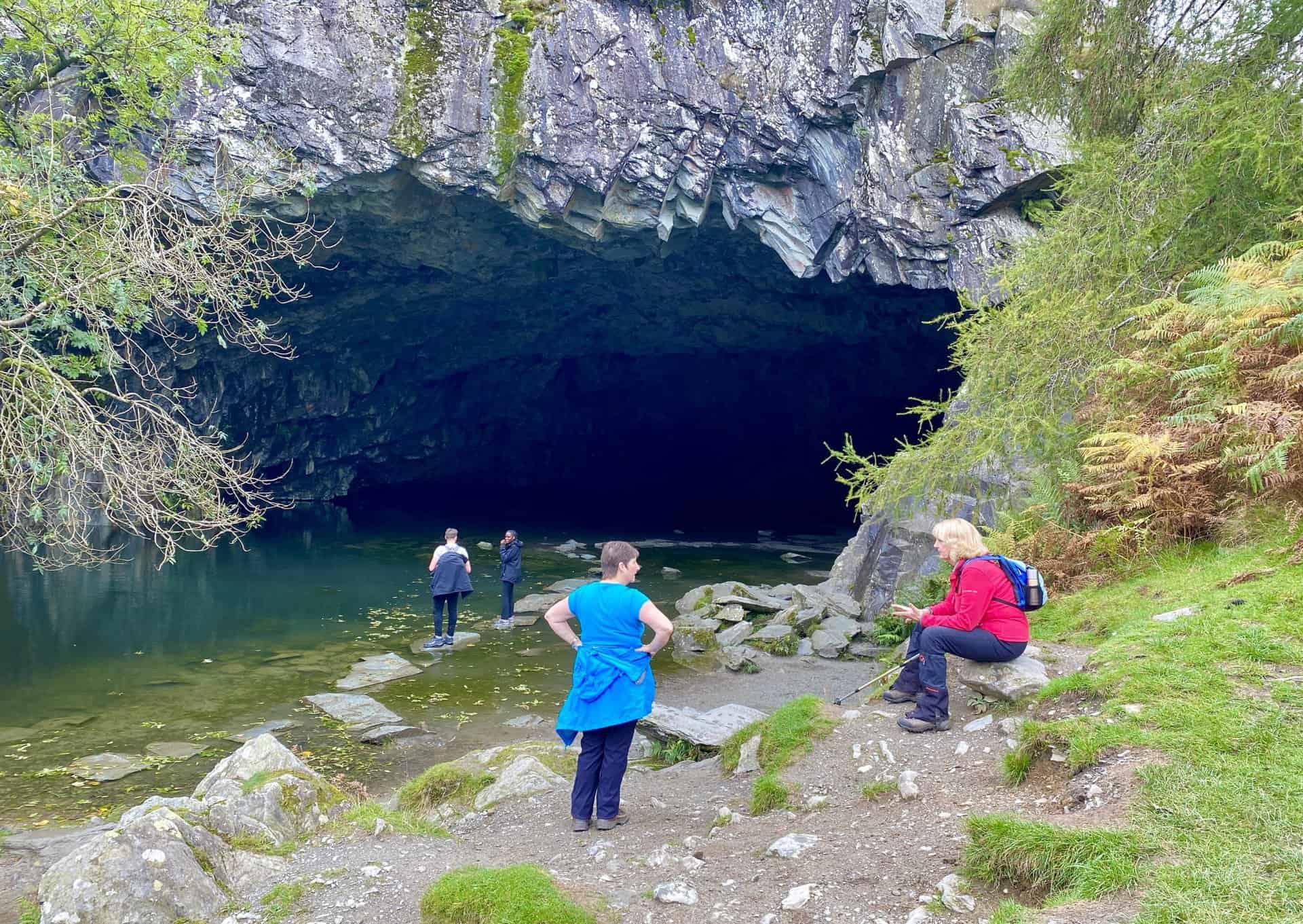 Rydal Cave. A man-made cave on the site of a former slate quarry, with stepping stones leading to a partially dry interior.