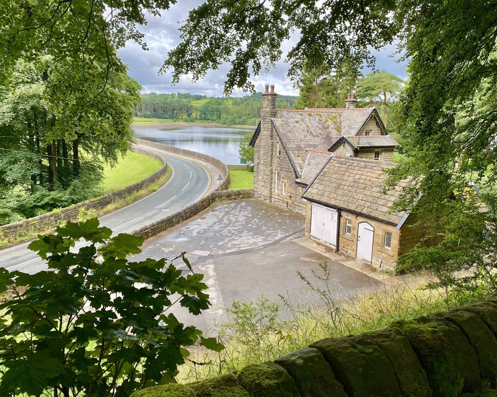 A downward view of Reservoir House at the northern extremity of Fewston Embankment.