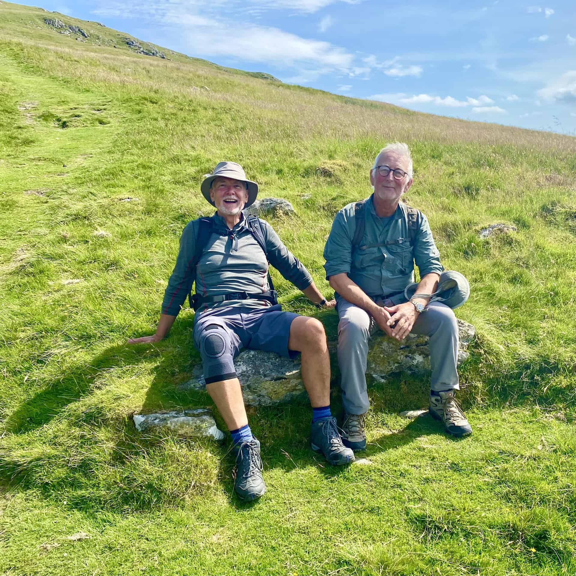 Mike and Keith have a rest on the steep, grassy slopes just east of Stanah.
