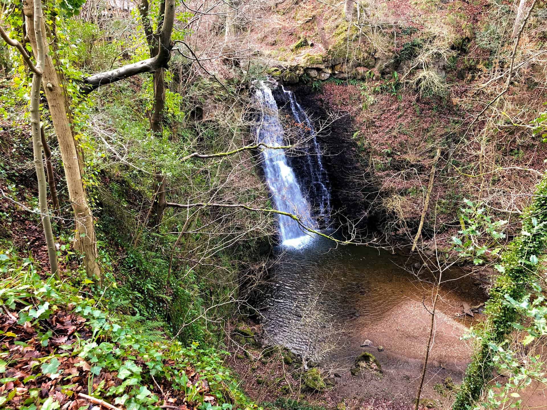The route's spectacle: the 30-foot Falling Foss waterfall.