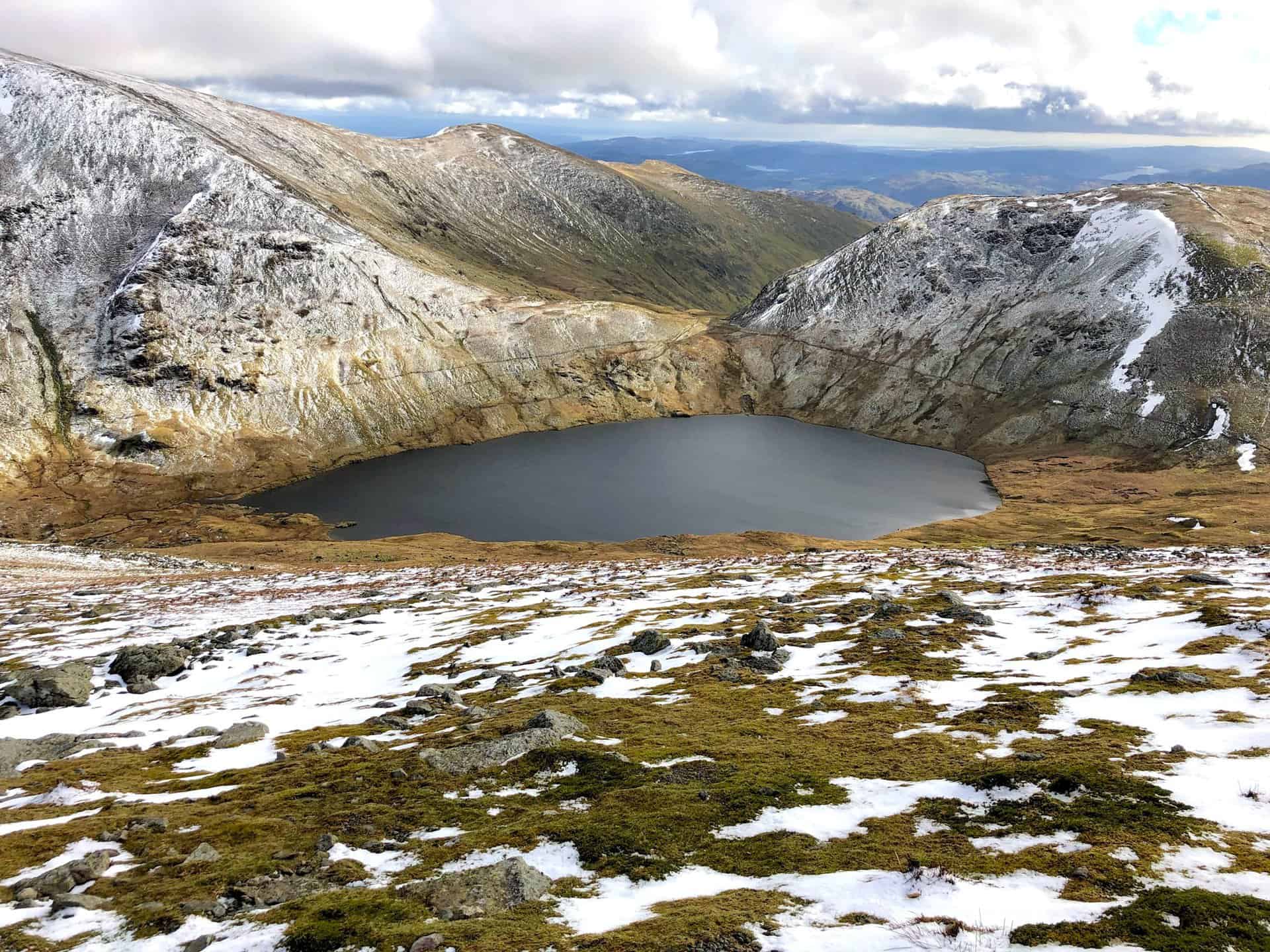 Grisedale Tarn's serene waters mark a tranquil spot on our walk.