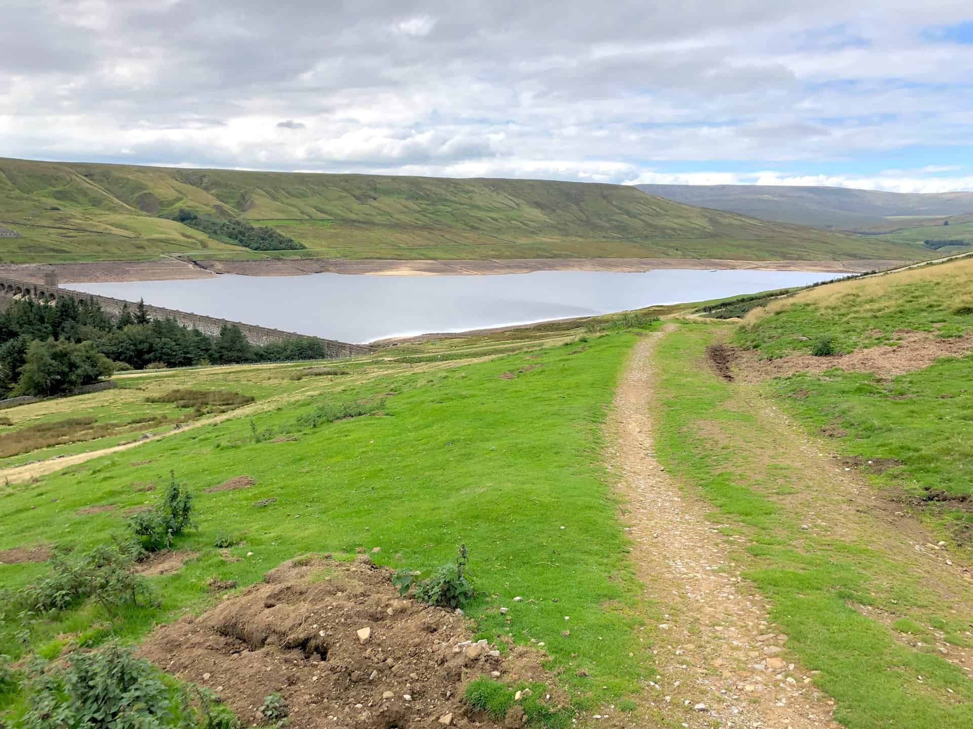 The dam contains over one million tonnes of masonry, rises to 55 metres above the river and is almost 600 metres long. It was completed in 1936. The reservoir is fed almost exclusively from Angram reservoir, which in turn is fed predominantly from the flanks of Great Whernside.