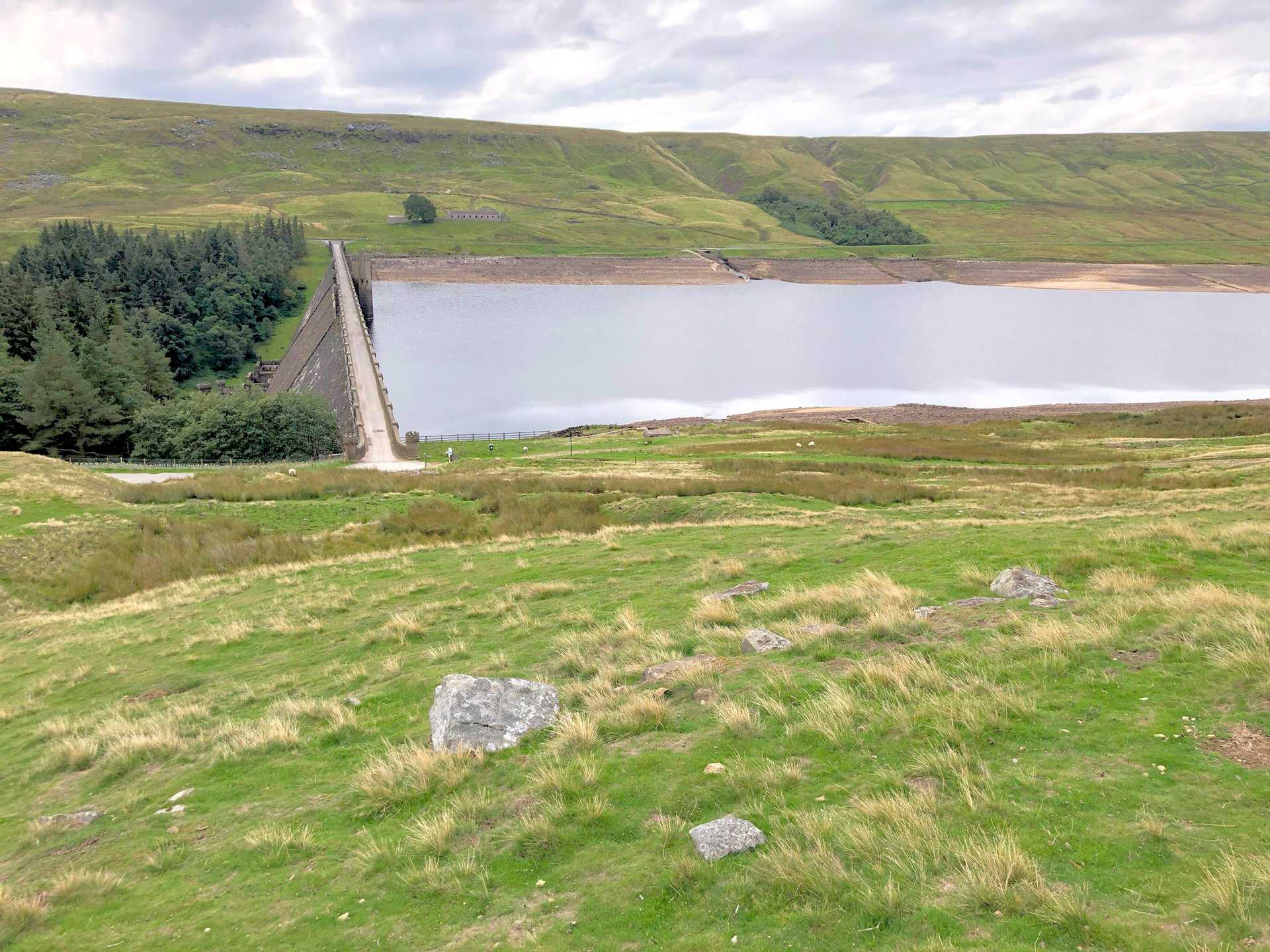 Scar House was the last reservoir to be built in the Nidd Valley and took fifteen years to complete. Stone for the dam was quarried from Carle Fell Side, to the north-west of the dam. Scar House was once home to more than 1250 villagers who built the Nidderdale dam, and evidence of the village can be seen in the form of concrete bases on the approach road to the reservoir.