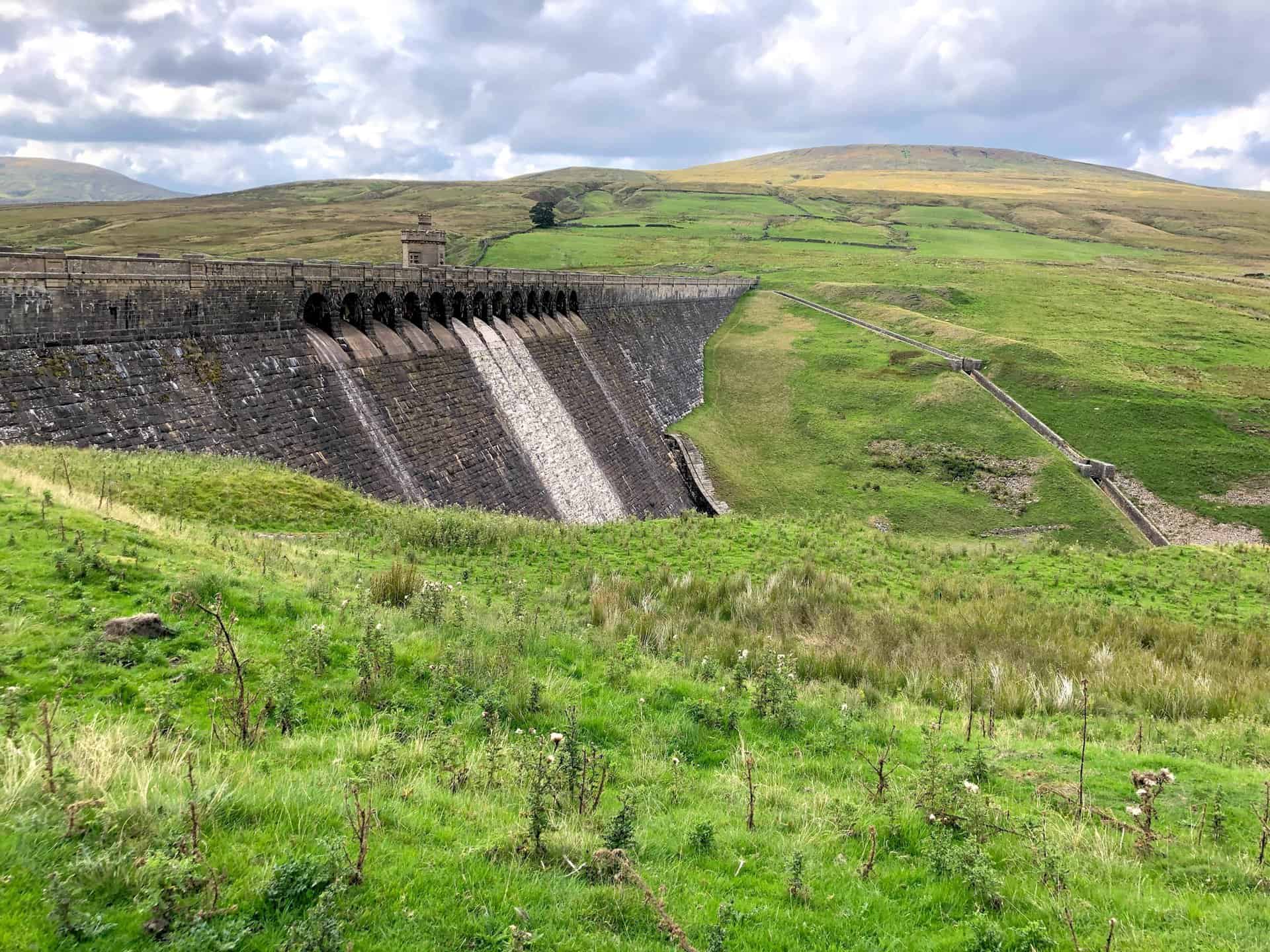 Angram Reservoir dam and tower. The hill in the background is Little Whernside.