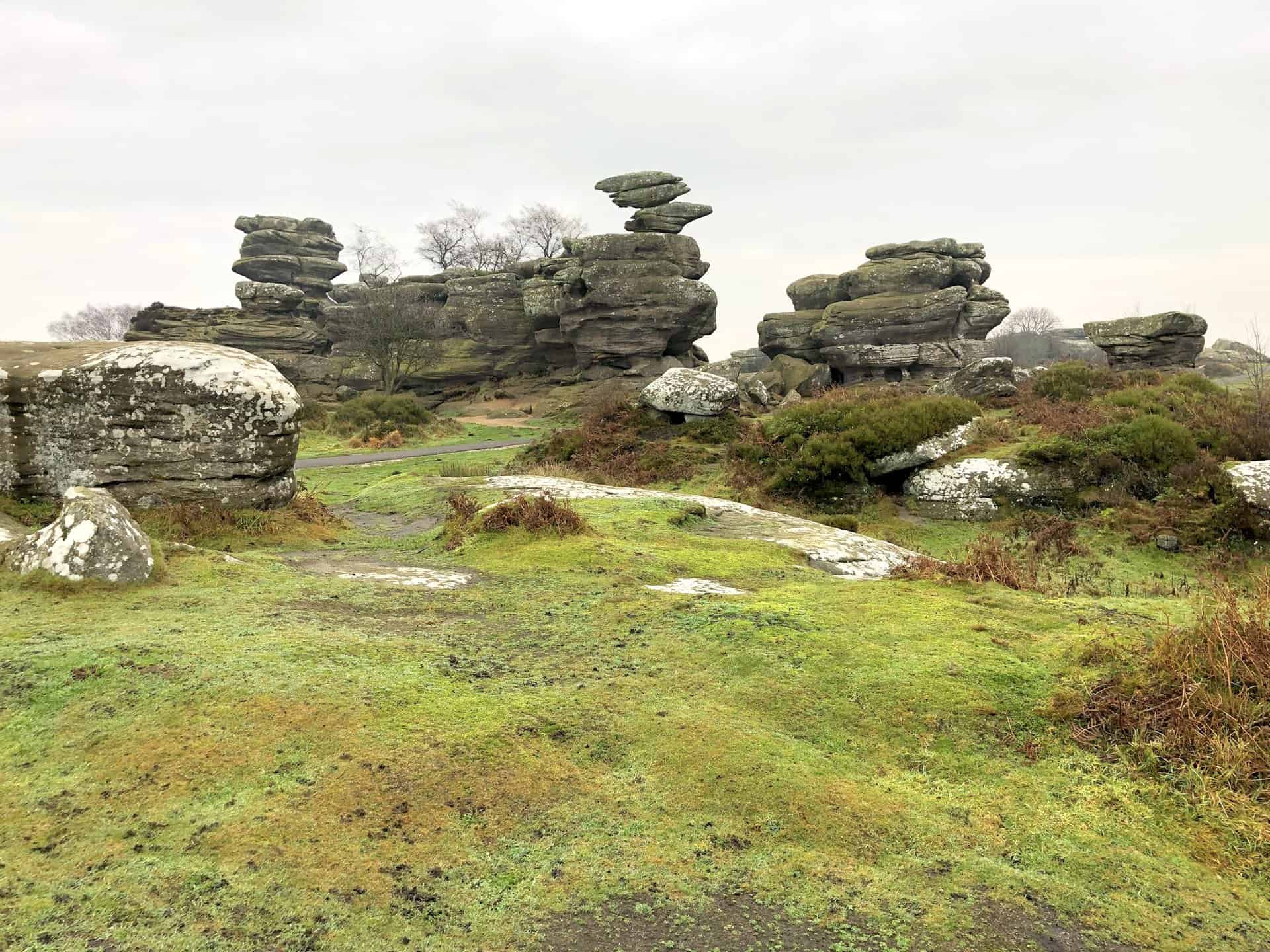 Brimham Rocks in North Yorkshire, notable for their balancing rock formations, standing at nearly 30 feet and situated within the Nidderdale Area of Outstanding Natural Beauty. This is about halfway round this particular Brimham Rocks walk.