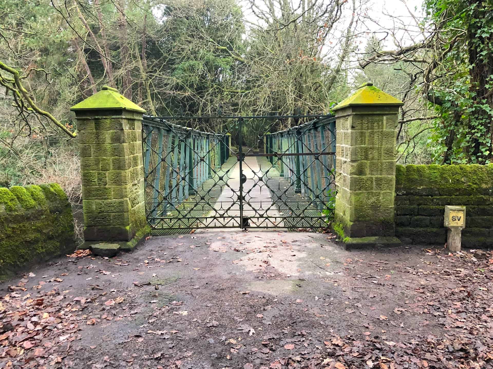 Gated bridge over the River Nidd.