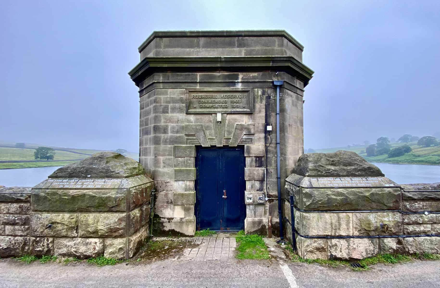 Roundhill Reservoir tower with the inscription:
ROUNDHILL.RESERVOIR
COMMENCED 1903
COMPLETED 1911