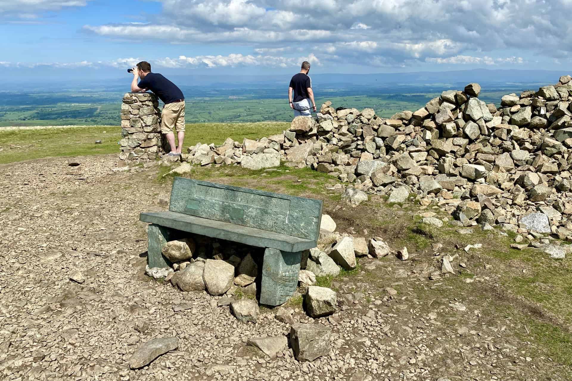 The summit of High Pike with extensive views north and north-west towards Carlisle and the Solway Firth respectively.