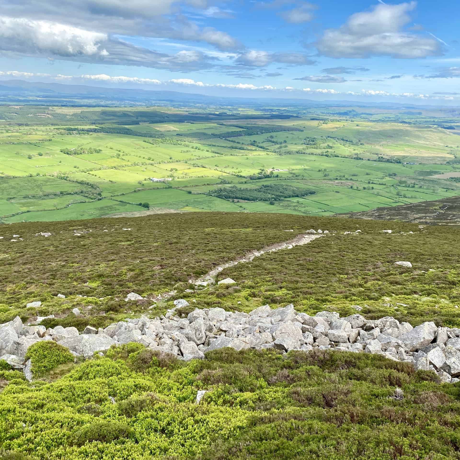 The view east from Carrock Fell over to Penrith and the North Pennines.
