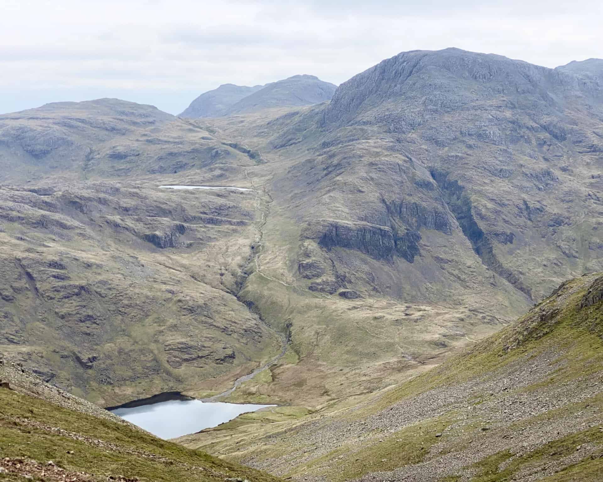 The view south-east from Windy Gap down to Styhead Tarn and over to the higher Sprinkling Tarn.