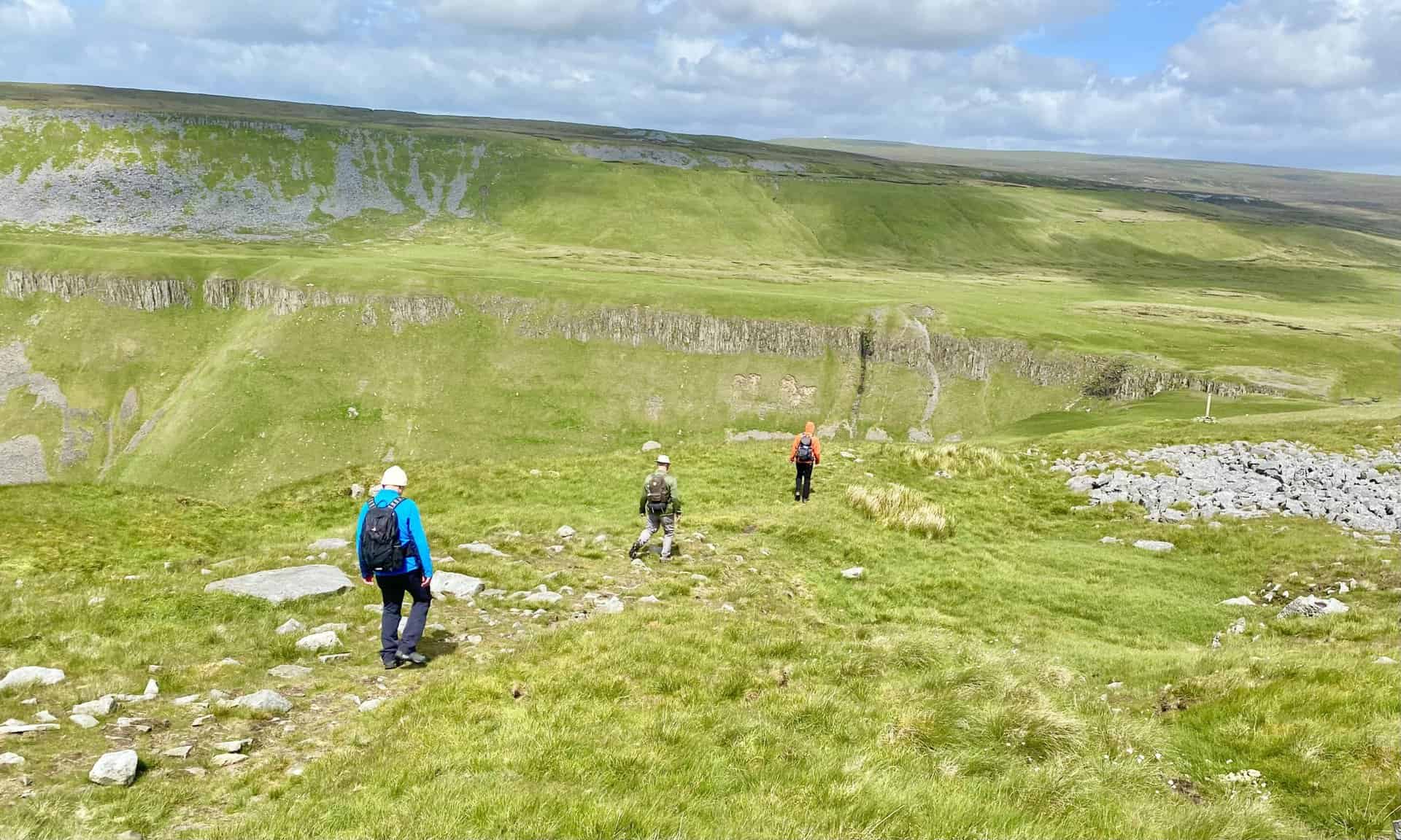 Making our way towards High Cup Nick on the upper of two paths above High Cup Scar, a key section of this High Cup Nick circular walk..