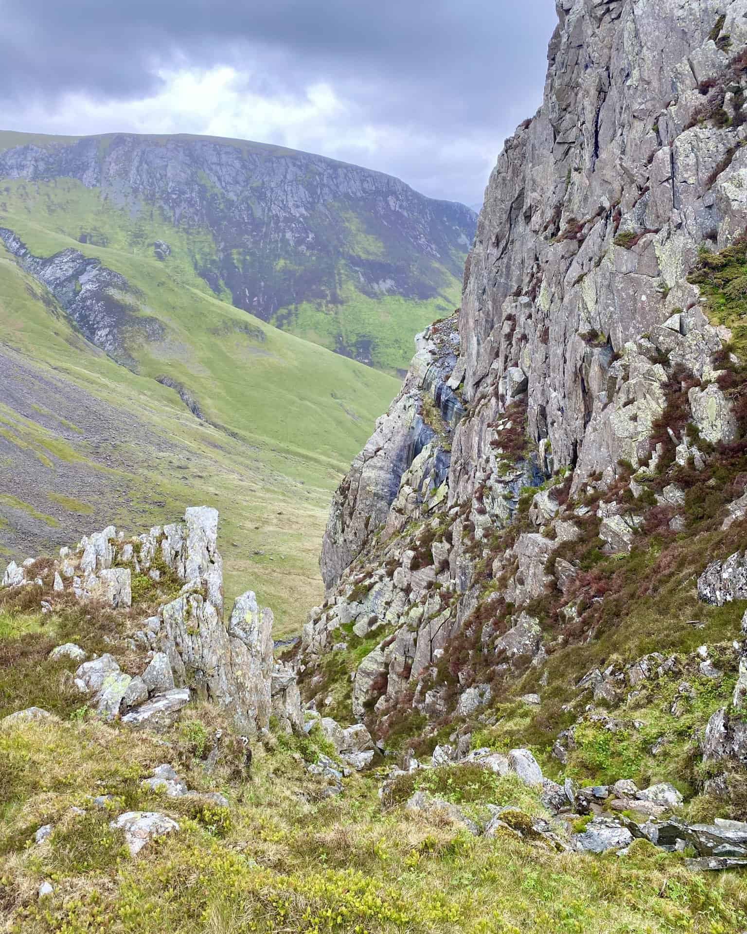 The view of Hindscarth Crags from the southern flanks of High Spy. The deep cut in the rocky landscape (on the left in both pictures) has been created by Far Tongue Gill, a tributary of Newlands Beck.