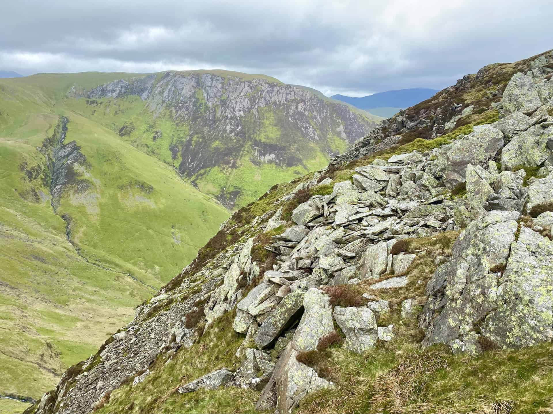 The view of Hindscarth Crags from the southern flanks of High Spy. The deep cut in the rocky landscape (on the left in both pictures) has been created by Far Tongue Gill, a tributary of Newlands Beck.