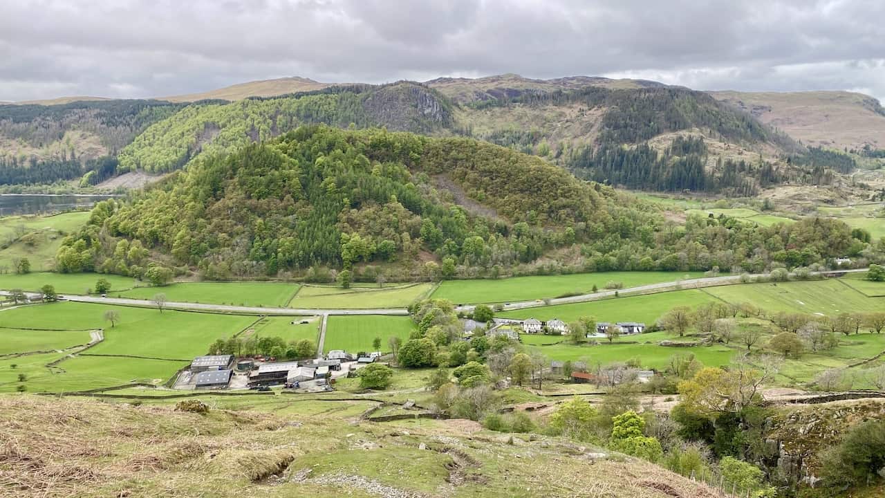 Looking down upon Stybeck Farm and Stanah. The tree-covered hill is Great How, backed by Raven Crag and The Benn.