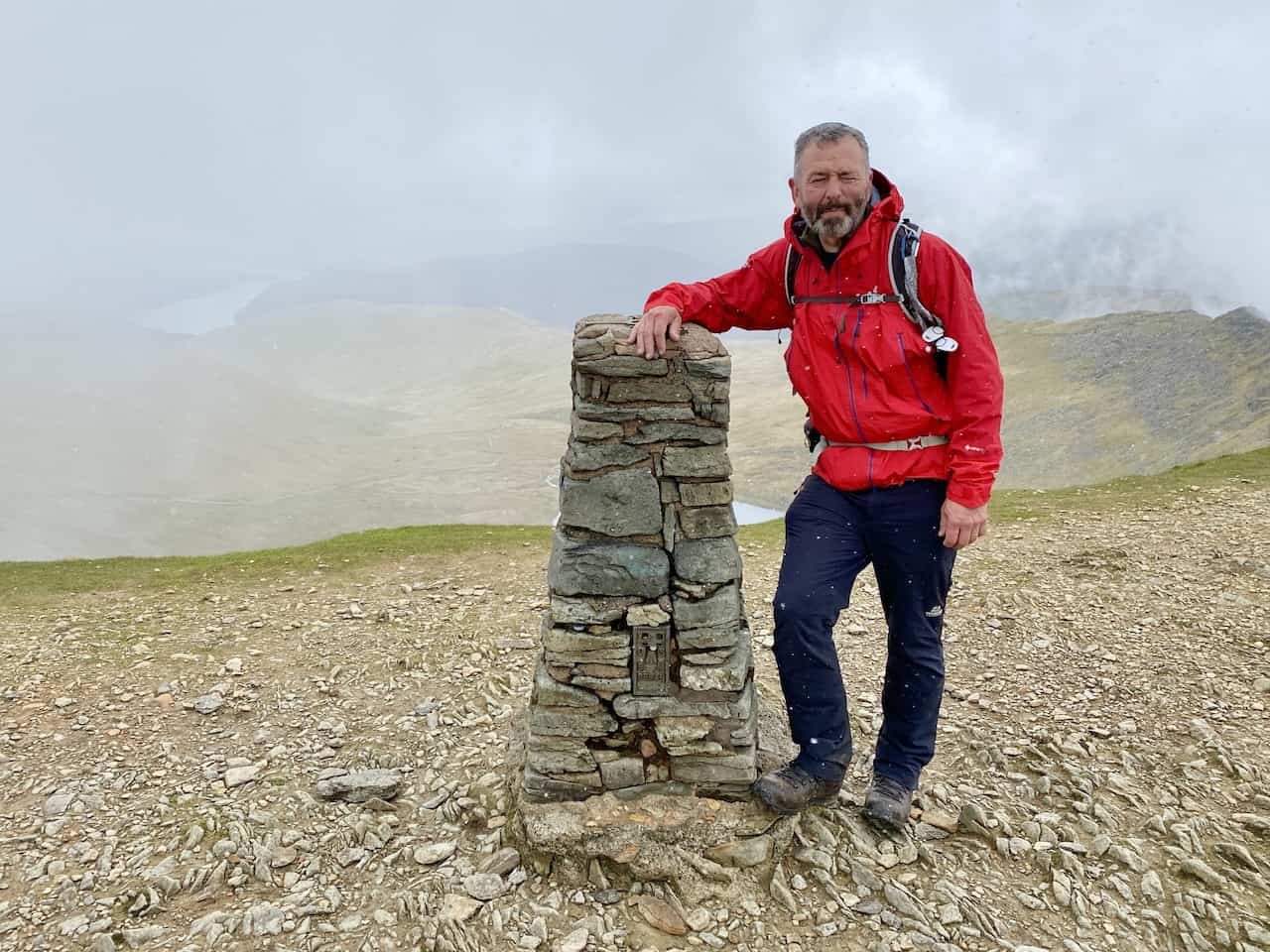 Triangulation pillar on Helvellyn, height 949 metres (3114 feet). Helvellyn is the third highest mountain in the Lake District, the two higher ones being Scafell Pike and Scafell.
