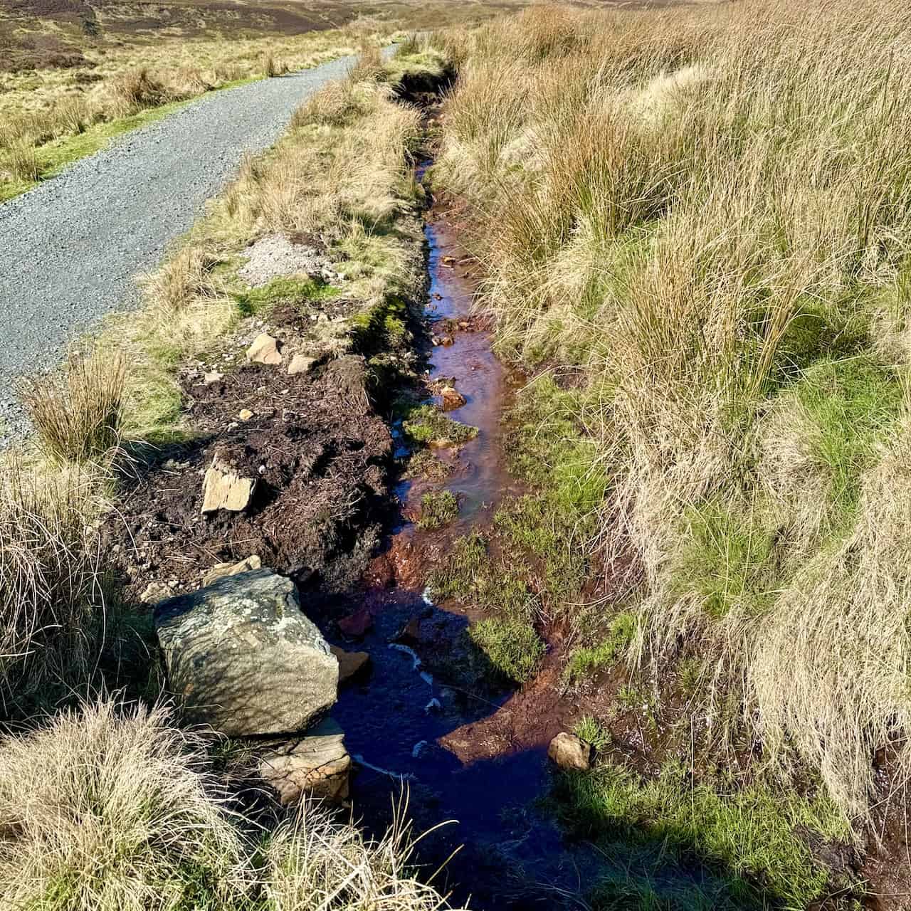 The orange-coloured water in streams, rivers, and standing bodies of water in the North York Moors is often a consequence of iron-rich groundwater seeping into these water bodies. As the iron dissolves and then oxidises, it imparts a striking orange or reddish hue to the water, especially notable in areas of past mining activities that have exposed ironstone to the elements. However, natural processes also contribute to this effect.