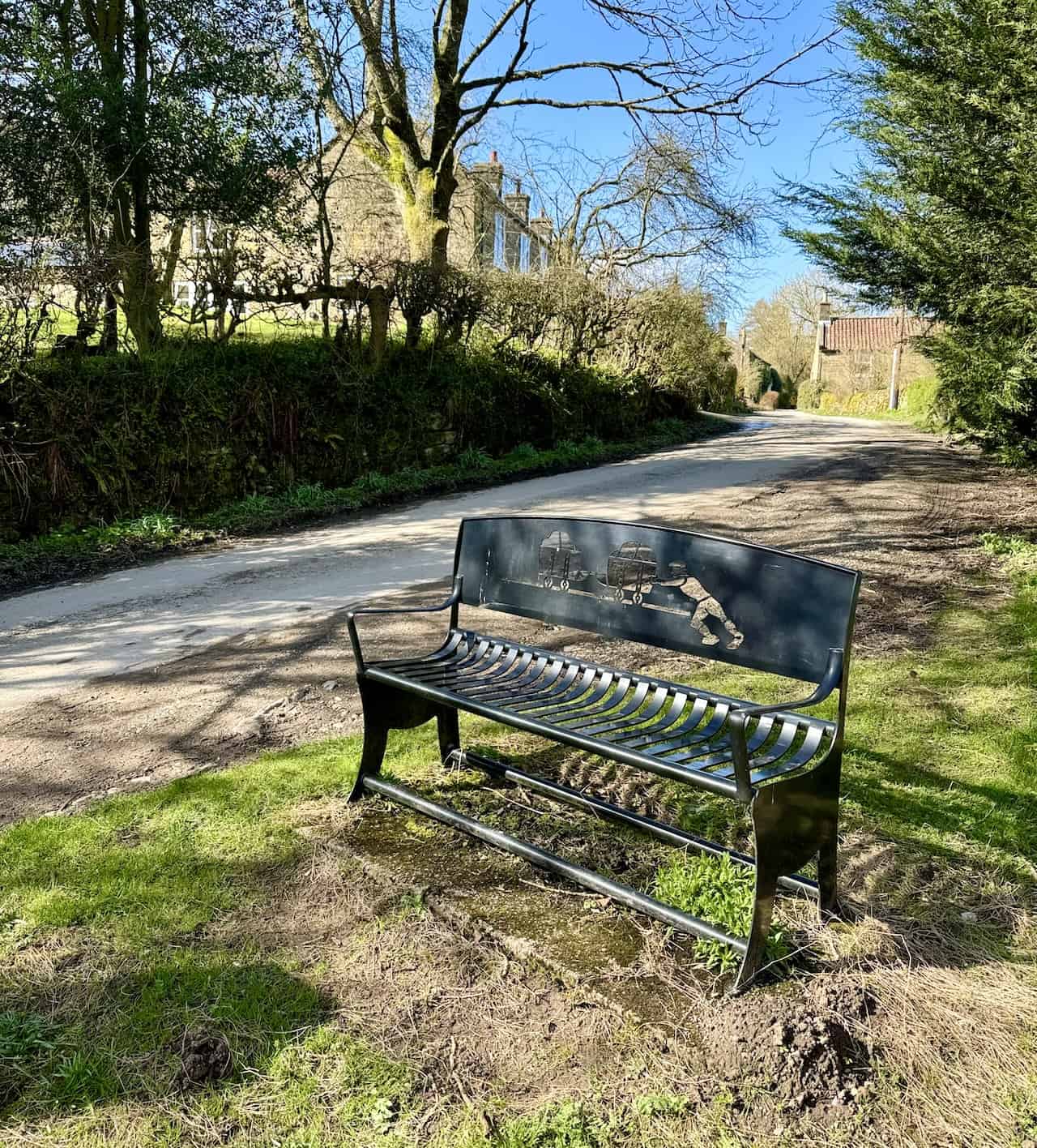 In Thorgill, an artistic iron bench depicts a worker pushing railway carts laden with ironstone, blending historical significance with local craftsmanship.