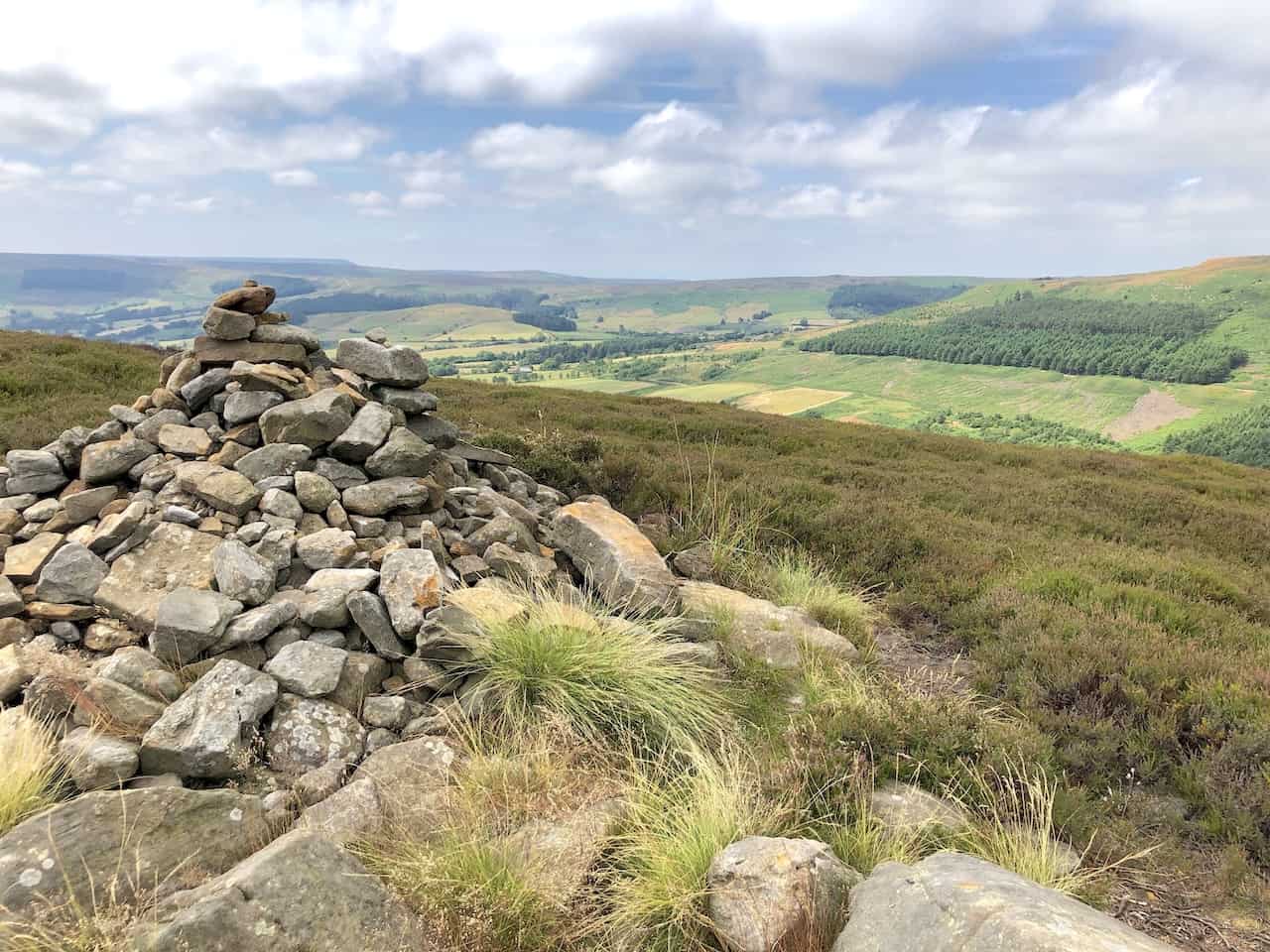 Cairn at the top of Cold Moor, standing at an elevation of 390 metres (1280 feet), marks a serene waypoint for hikers.