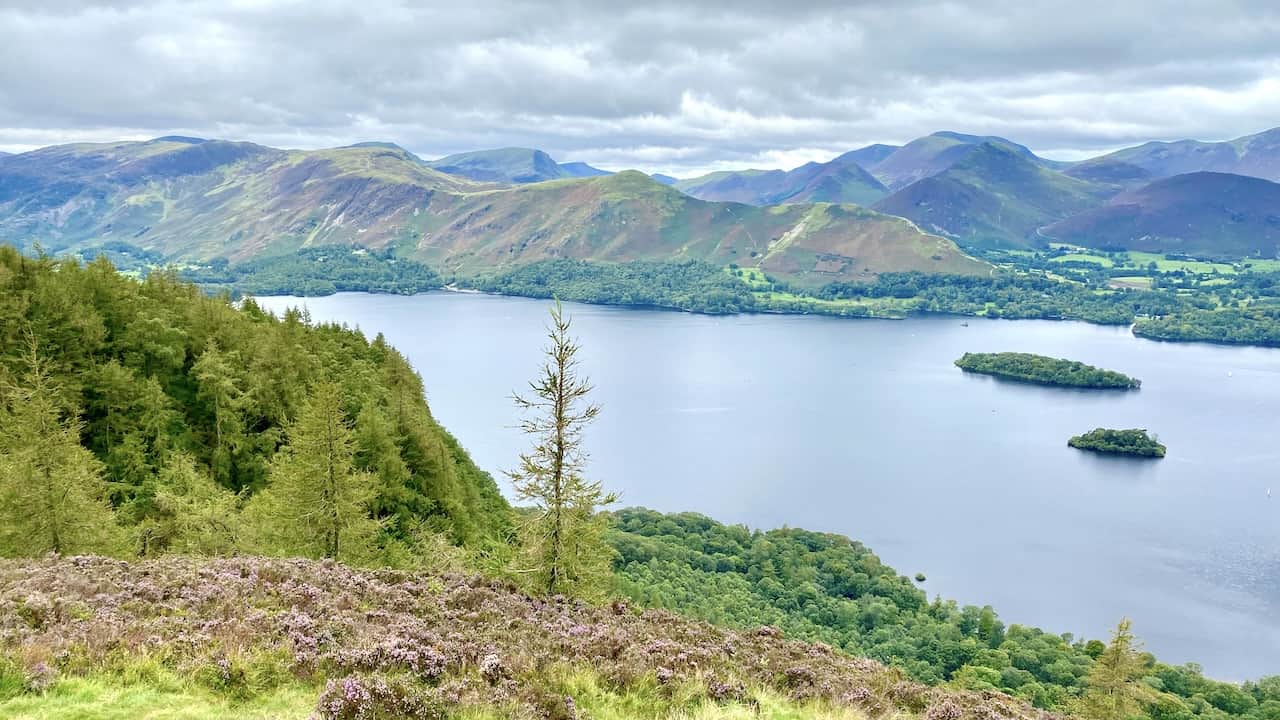 Looking west across Derwent Water from Walla Crag. The smaller island is Rampsholme Island and the larger one is St Herbert's Island. Immediately behind the lake is the ridge made up of Skelgill Bank, Cat Bells, Maiden Moor and High Spy. Further back are some of the other north-western fells such as Barrow, Rowling End, Causey Pike and Robinson to name but a few.