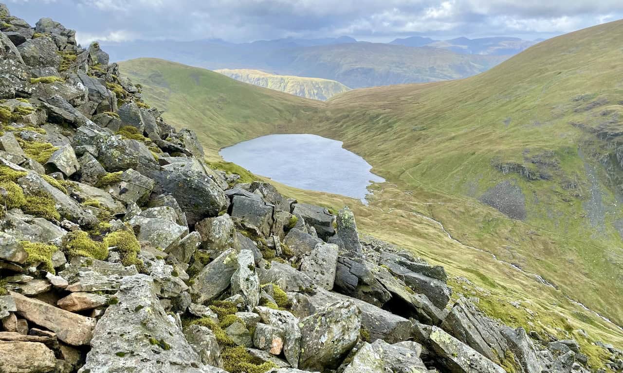Grisedale Tarn at the head of the Grisedale valley, backed by Seat Sandal and flanked by Dollywaggon Pike and Fairfield.