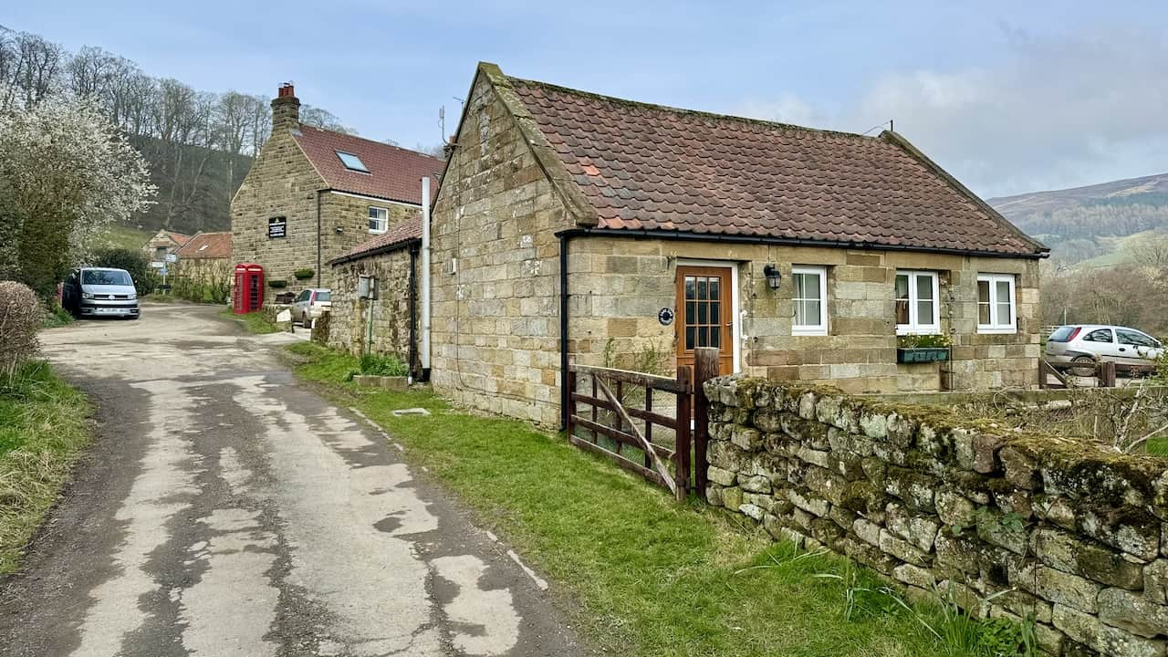 Mill Lane leads to the Feversham Arms in Church Houses, marking a picturesque route.