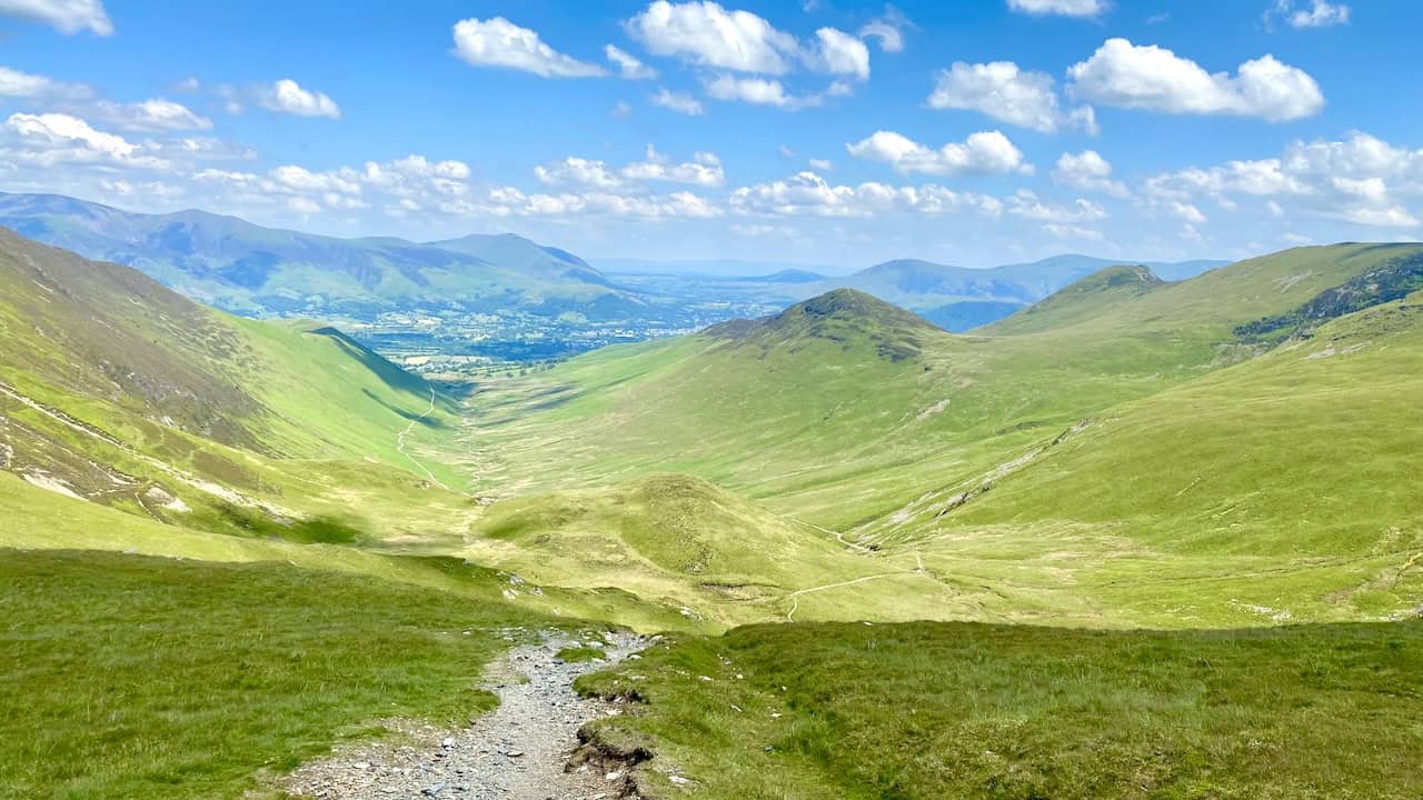 Looking north-east from Coledale Hause towards Keswick, with the mountain ranges of Skiddaw and Blencathra in the background.