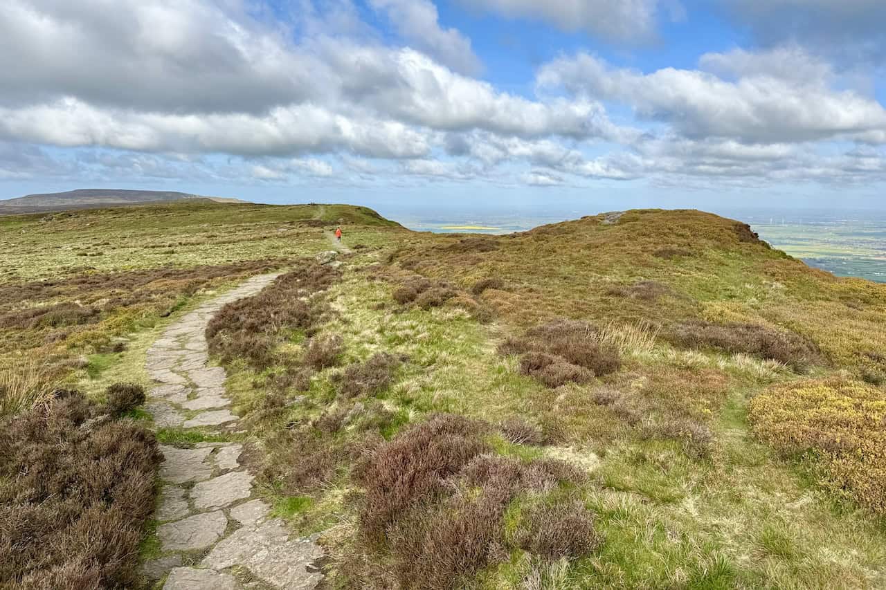Continuing west across the Cleveland Way on White Hill at 398 metres (1306 feet), the path becomes easier after the initial climb. The well-defined footpath, paved with large stone slabs, facilitates a pleasant walk.
