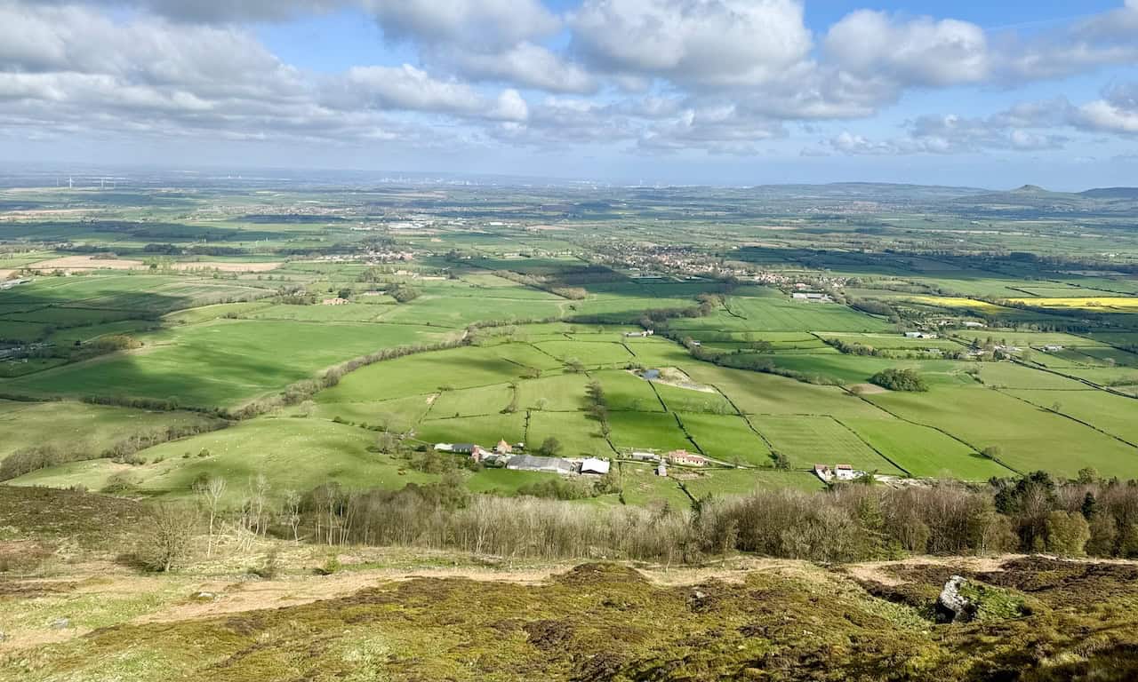 Spectacular views north from the summit of Cold Moor at 402 metres (1318 feet) include Broughton Banks Farm and the sweeping countryside towards Great Broughton, Stokesley, Great Ayton, and the distant Teesside.