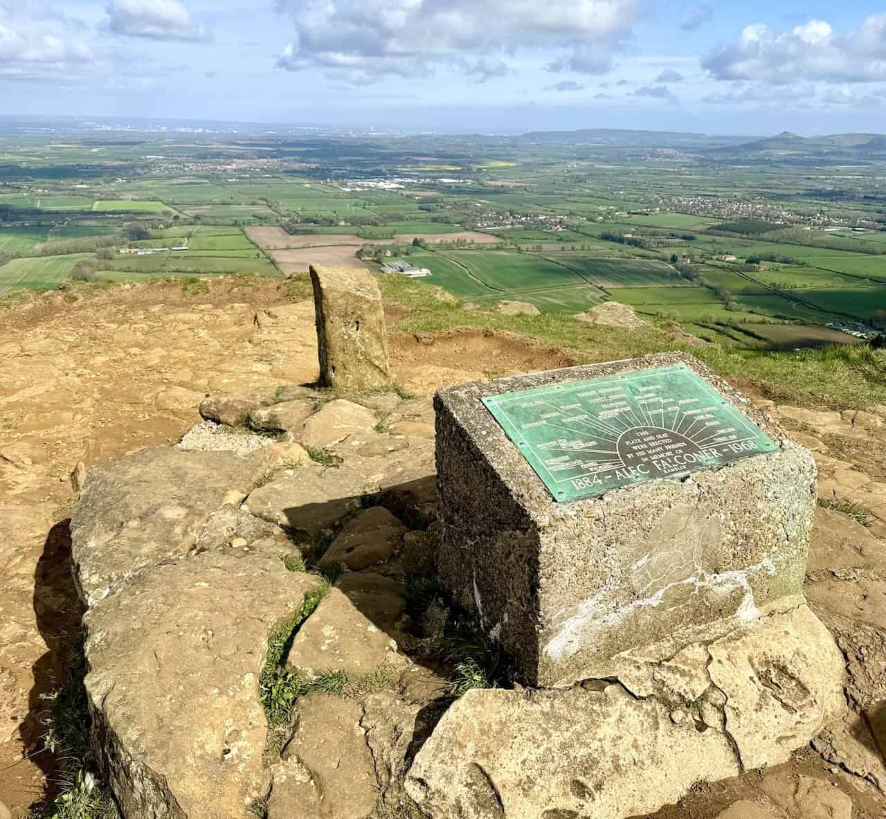 At the viewpoint on Cringle Moor, there is a seat and a topographical plate erected by the friends of Alec Falconer (1884-1968) in his memory. The plate commemorates Alec as a rambler. On clear days, the superb views explain why one would cherish time spent here.