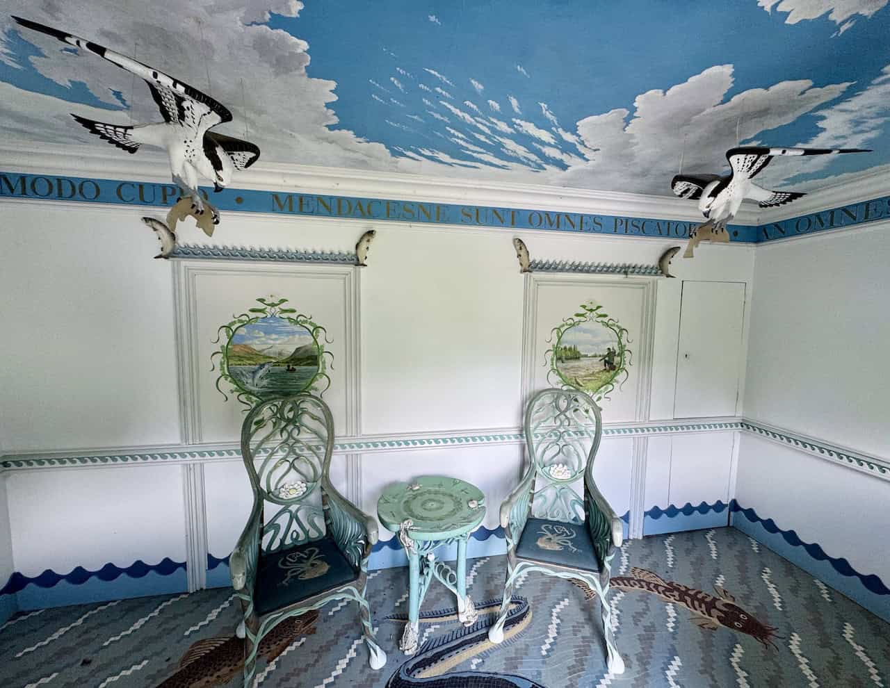 Mosaic floors and painted fishing scenes decorate the temple’s small interior.
