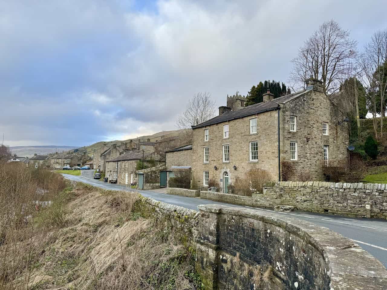 Stone barns and meadows around Muker with views towards Kisdon and the River Swale.
