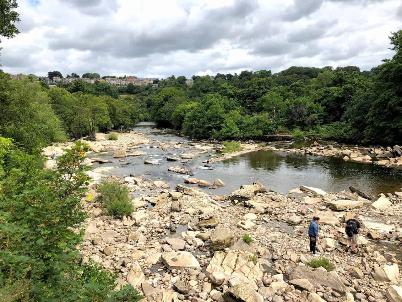River Swale flowing through Richmond with fast-moving water and rocky banks.