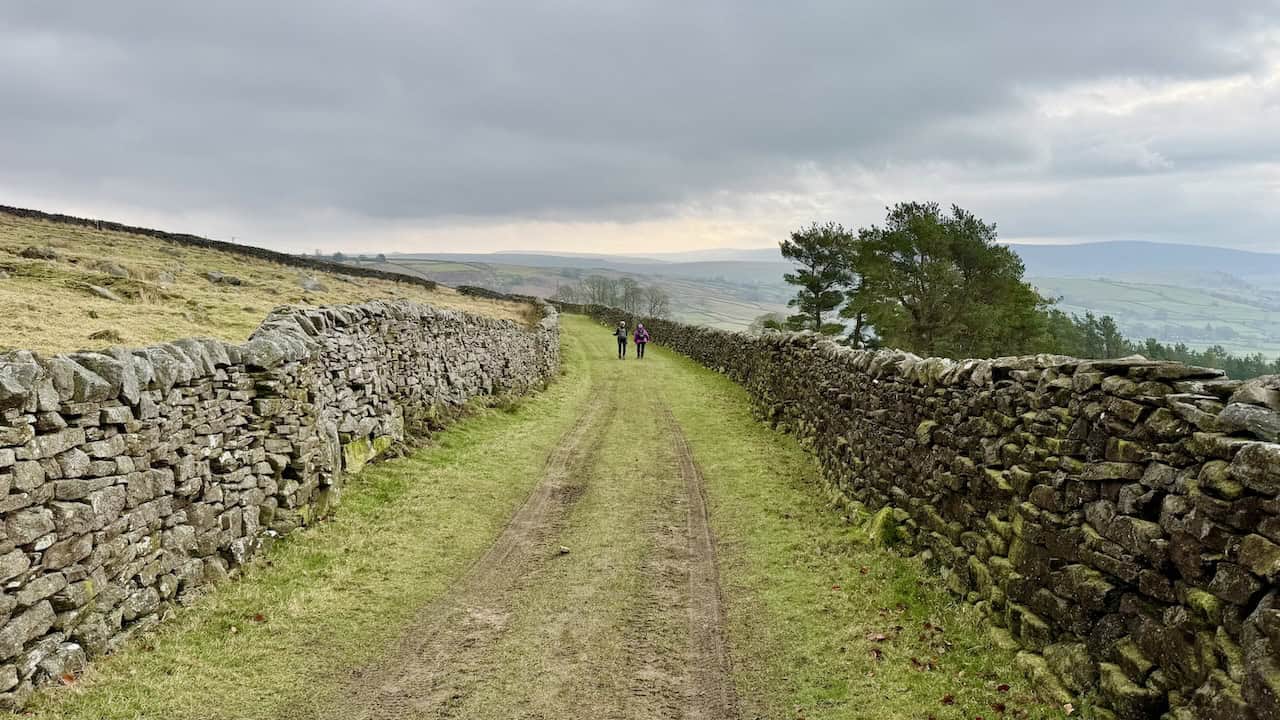 The elevated hillside track of Edge Lane, offering fine views down to Grassington on the Grassington circular walk.