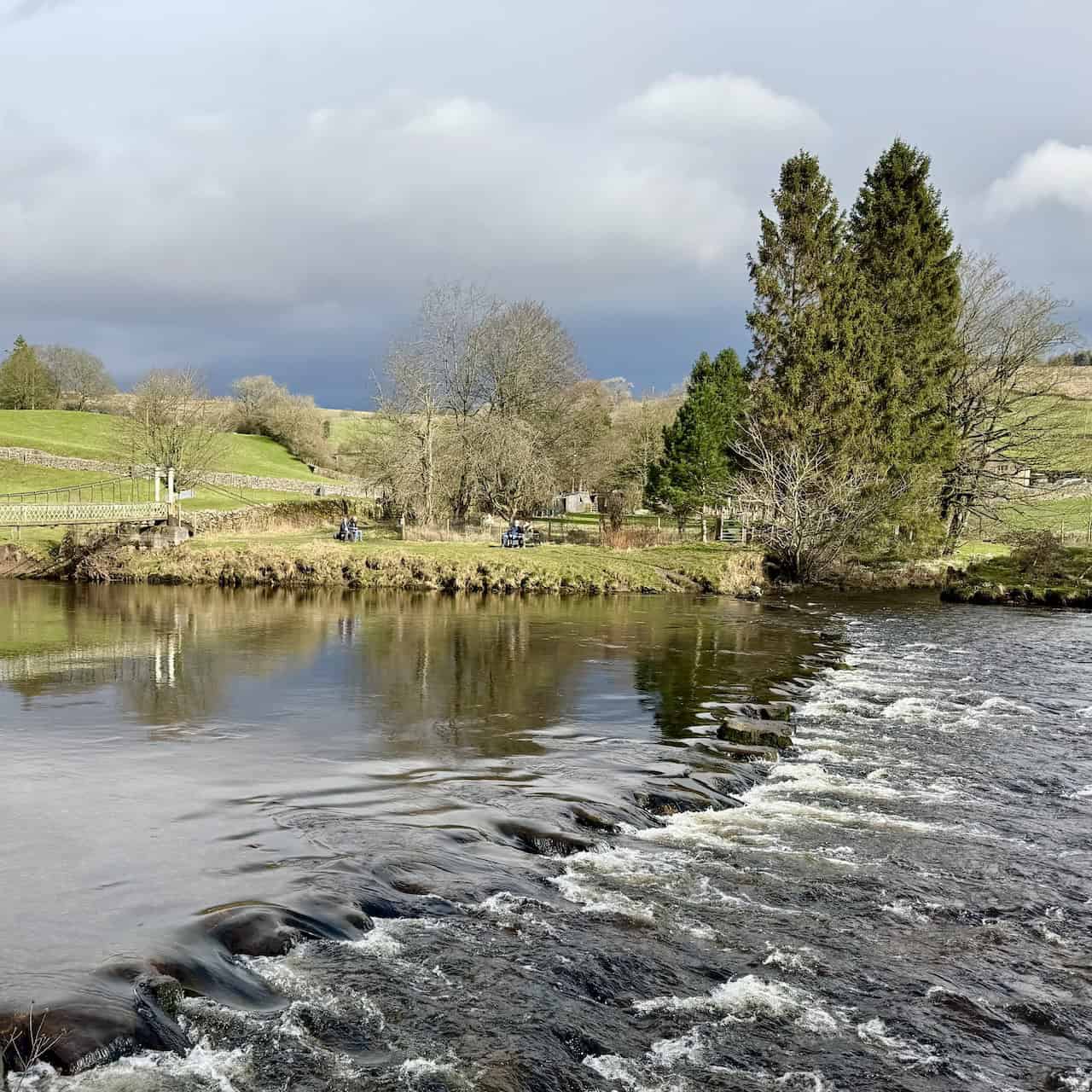 The stepping stones across the River Wharfe near Hebden Suspension Bridge, which may not be passable in wet weather when the water level is high.