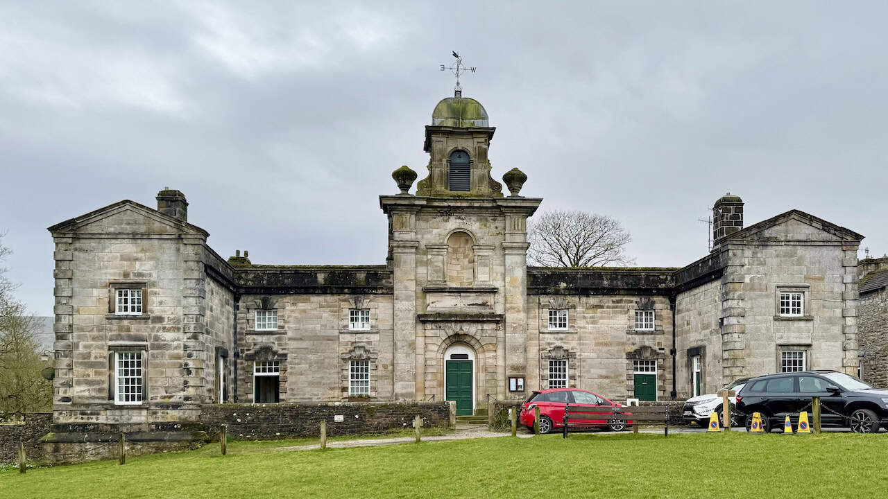 The grand baroque facade of Fountaine's Hospital in Linton, an extraordinary almshouse built in 1721 whose design has been ascribed to Sir John Vanbrugh or Nicholas Hawksmoor.