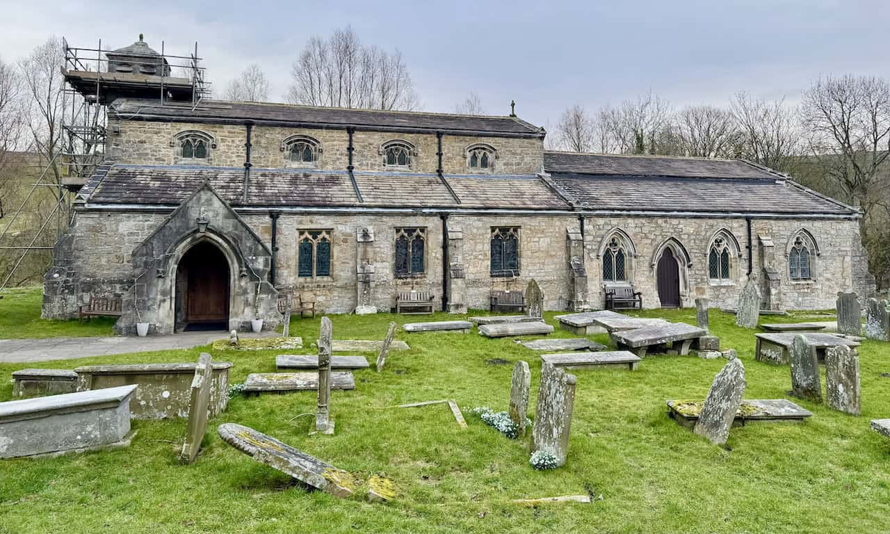 The exterior of St Michael's and All Angels Church in Linton, a Grade II* listed building on the Grassington circular walk, standing in a peaceful setting close to the southern bank of the River Wharfe.