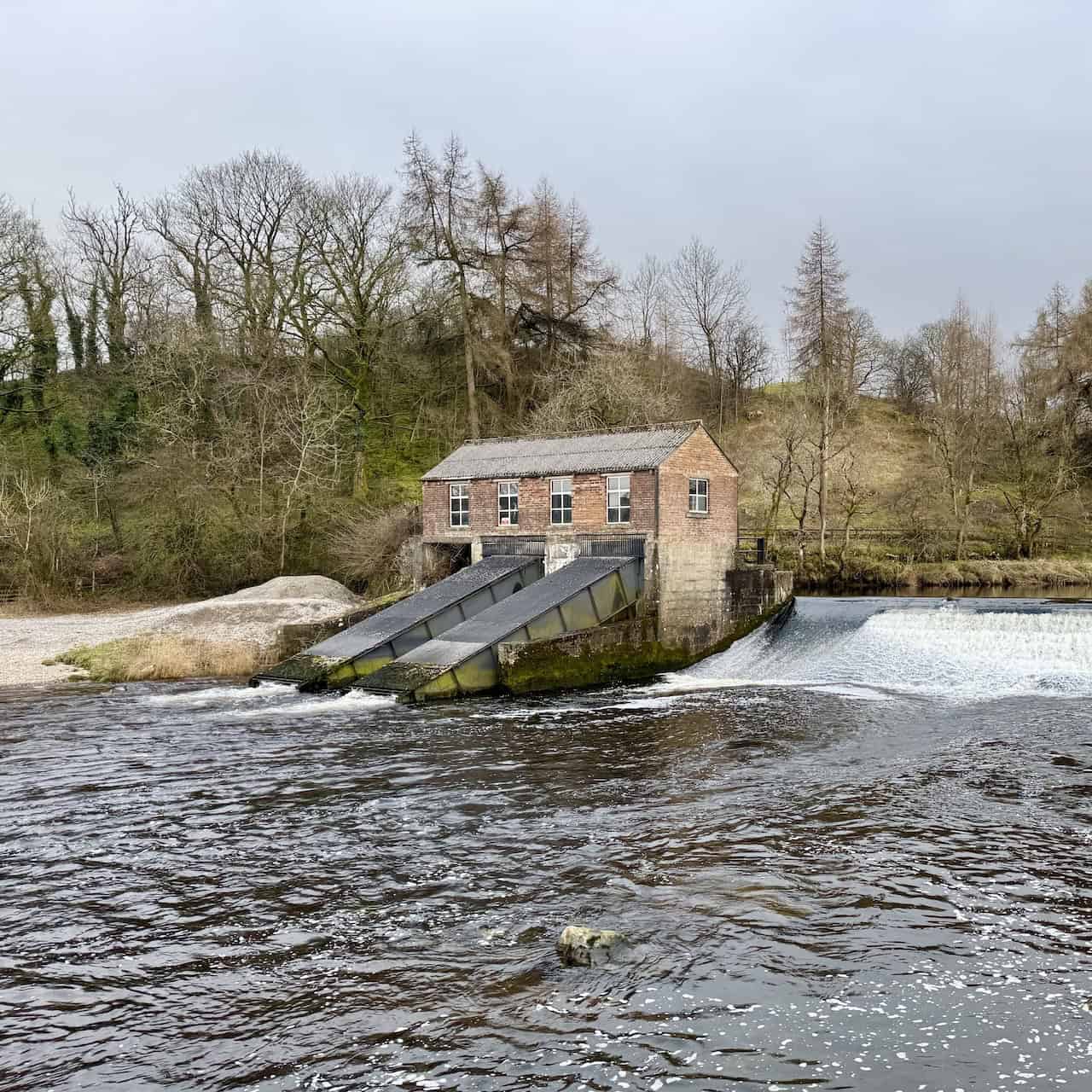 A view of Linton Falls Hydro from a different angle on the Grassington circular walk, showing the historic turbine house that once supplied electricity to Grassington in the early 20th century.