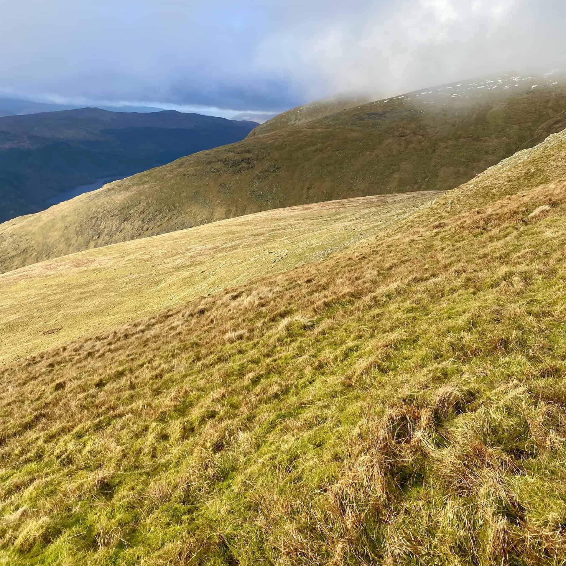 Grassy slopes of Middle Tongue and Whelp Side beneath Nethermost Pike.