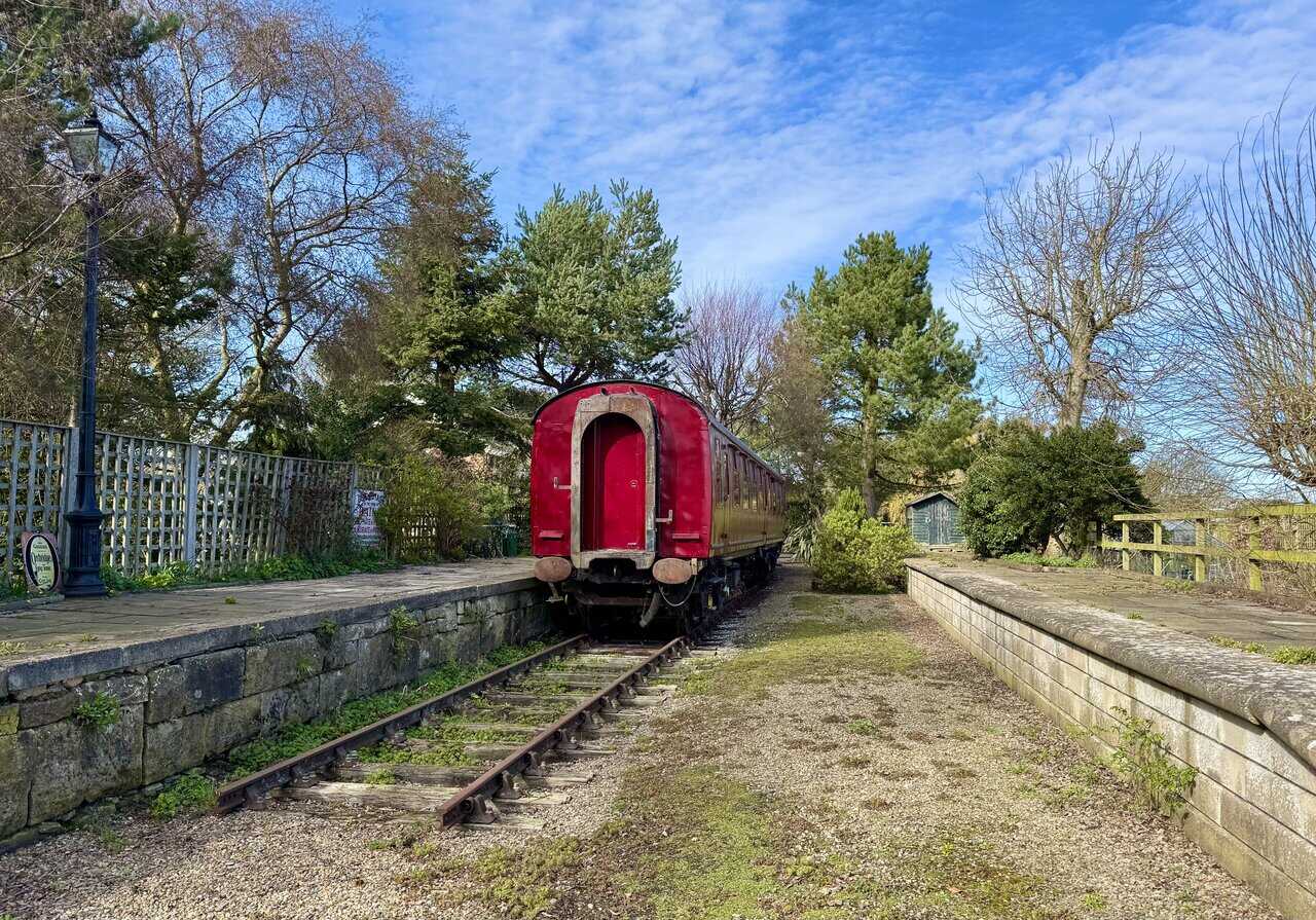 Sign above the Old Goods Shed entrance, showing the converted former railway building now used as holiday accommodation.