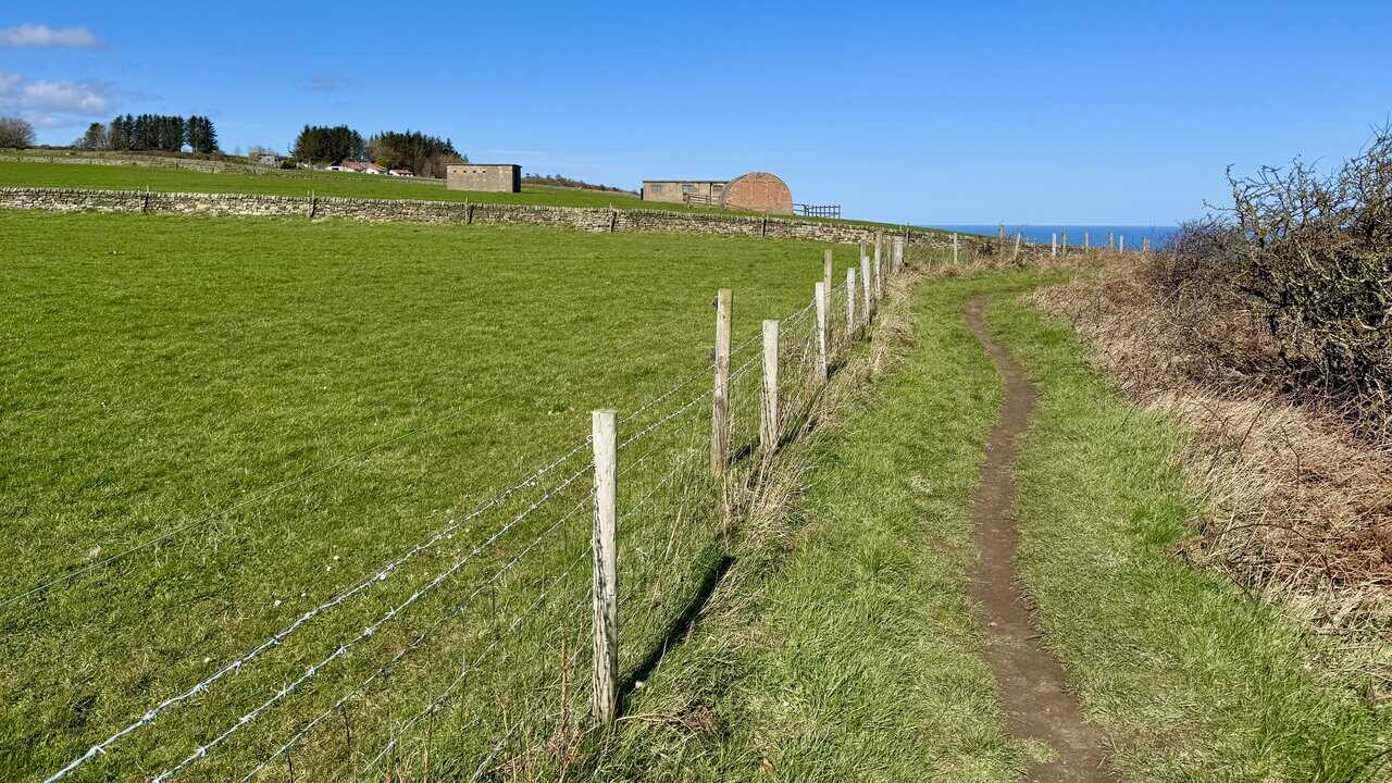 Clifftop path approaching the remains of the Ravenscar World War II Radar Station.