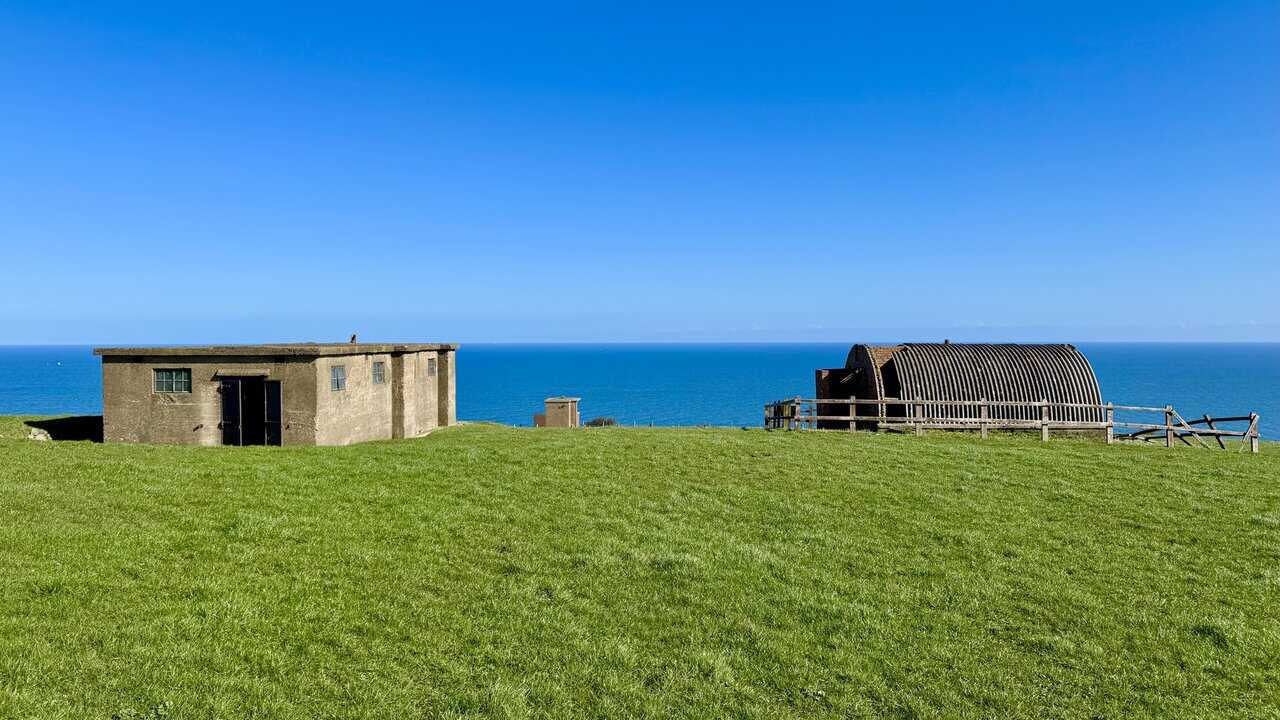 Ruined radar station accommodation site on the hillside above the main station buildings.