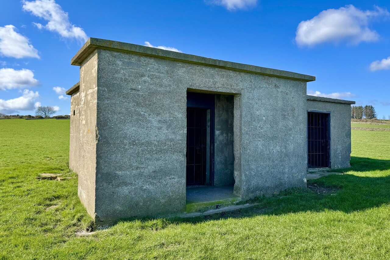 Interior of the Engine House showing the outline of the former generator base and wall vents.