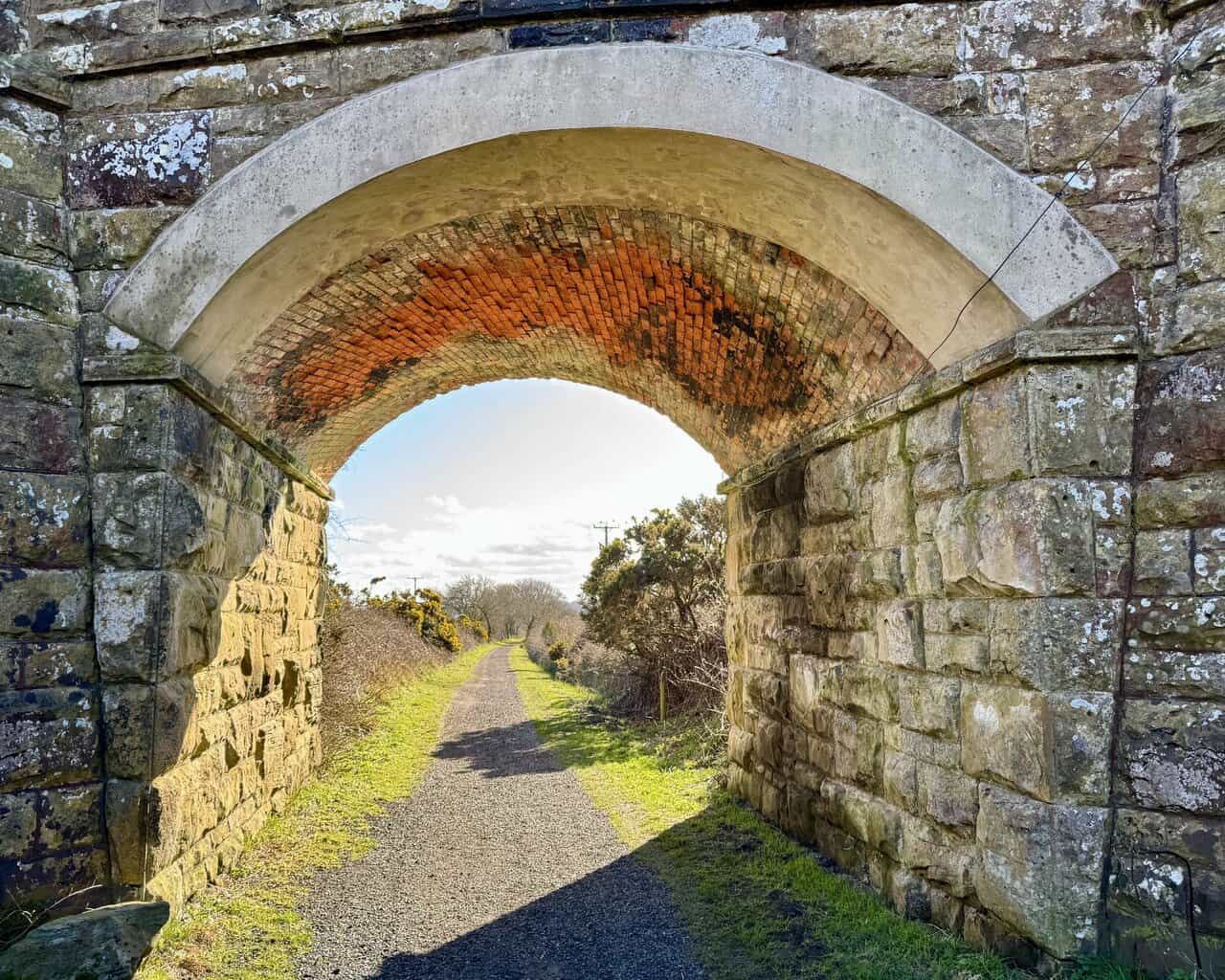 Stone railway tunnel beneath Bent Rigg Lane on the Cinder Track. A peaceful spot on the Hayburn Wyke walk.