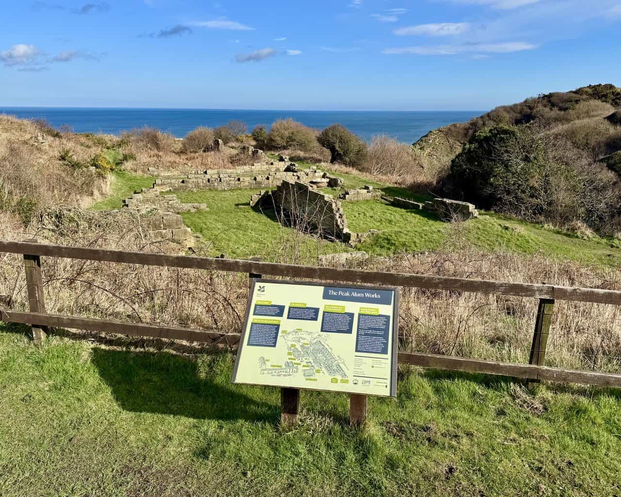 Historic stone structures and spoil heaps at Peak Alum Works, overlooking the coast where alum was once quarried and processed.