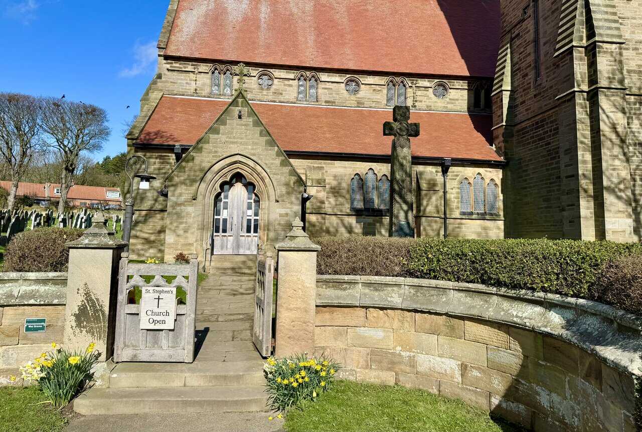 St Stephen’s Church on Thorpe Lane, a sandstone parish church with a red tile roof standing in the spring sunshine.